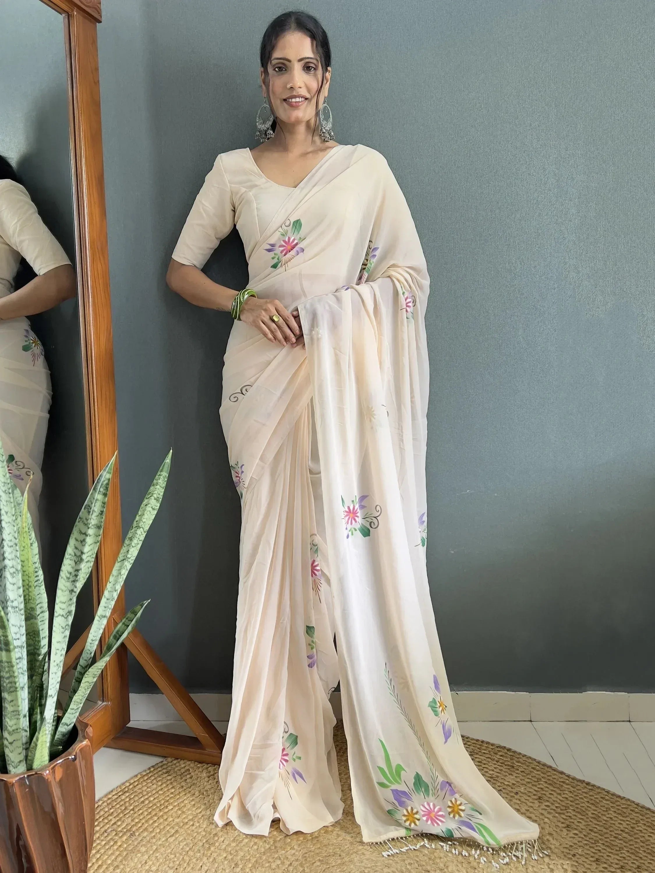 Cream floral printed saree with hand-painted motifs, perfect for ethnic wear occasions