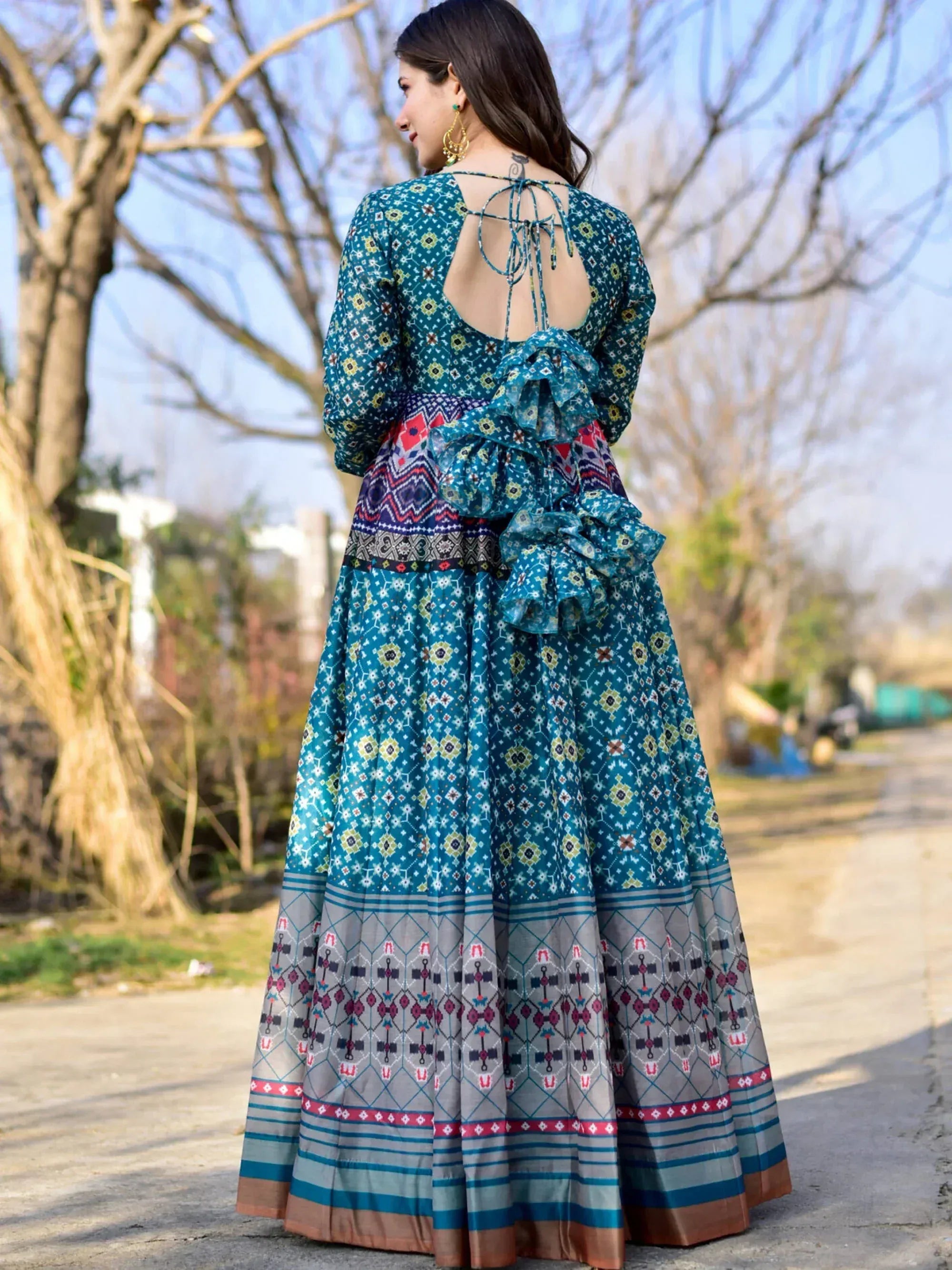 Teal printed ethnic gown with back tie-up and ruffle detail, perfect for Indian occasions