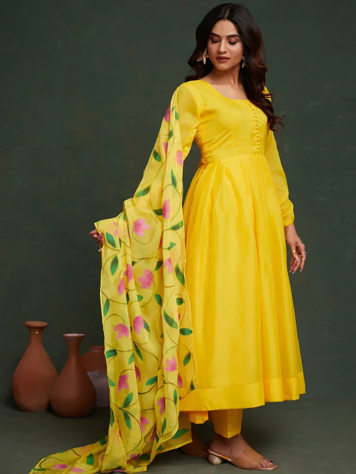 Yellow ethnic gown with floral dupatta, perfect for Indian festive occasions