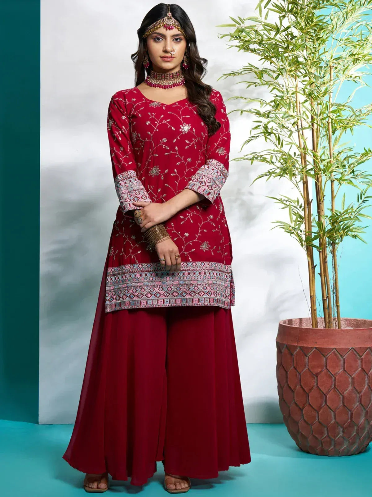 Red embroidered Indian salwar kameez with floral design and palazzo pants, perfect for ethnic occasions