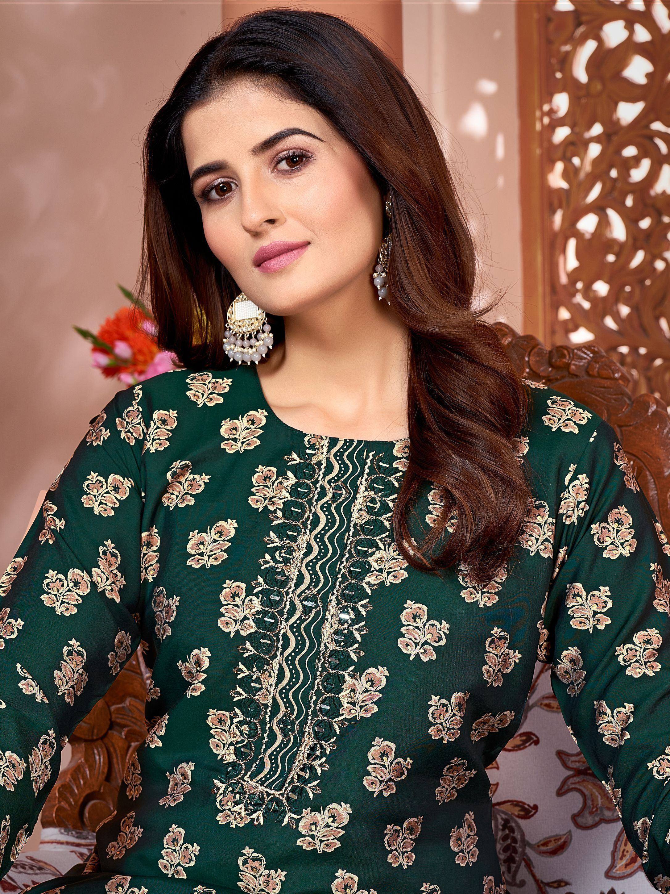 Woman in green floral embroidered salwar kameez with gold detailing, ethnic wear for festive occasions