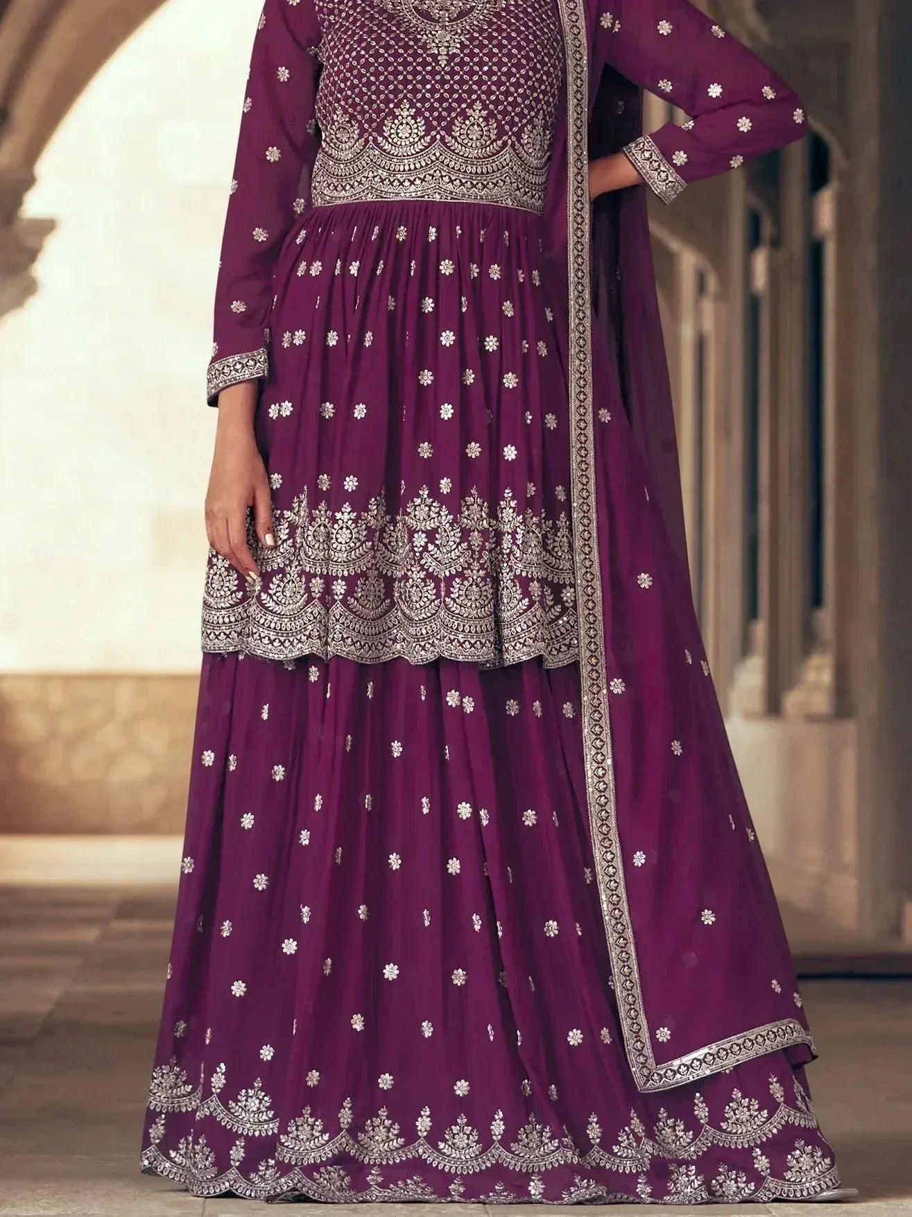 Elegant purple ethnic anarkali with silver embroidery and floral motifs, perfect for festive occasions.