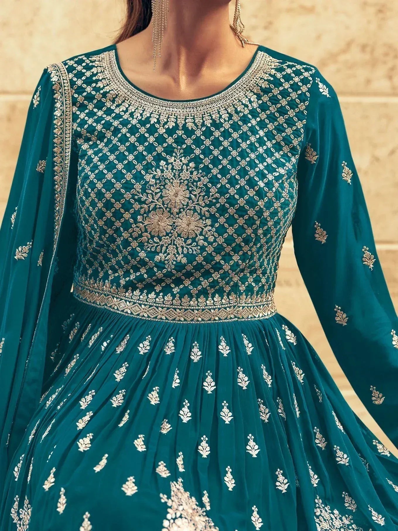 Teal green embroidered anarkali suit with gold floral work, perfect for Indian ethnic wear occasions.