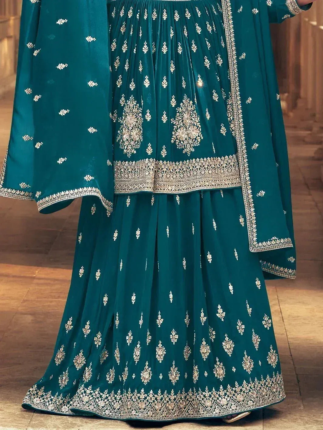 Teal green designer lehenga choli with intricate silver embroidery and border detailing