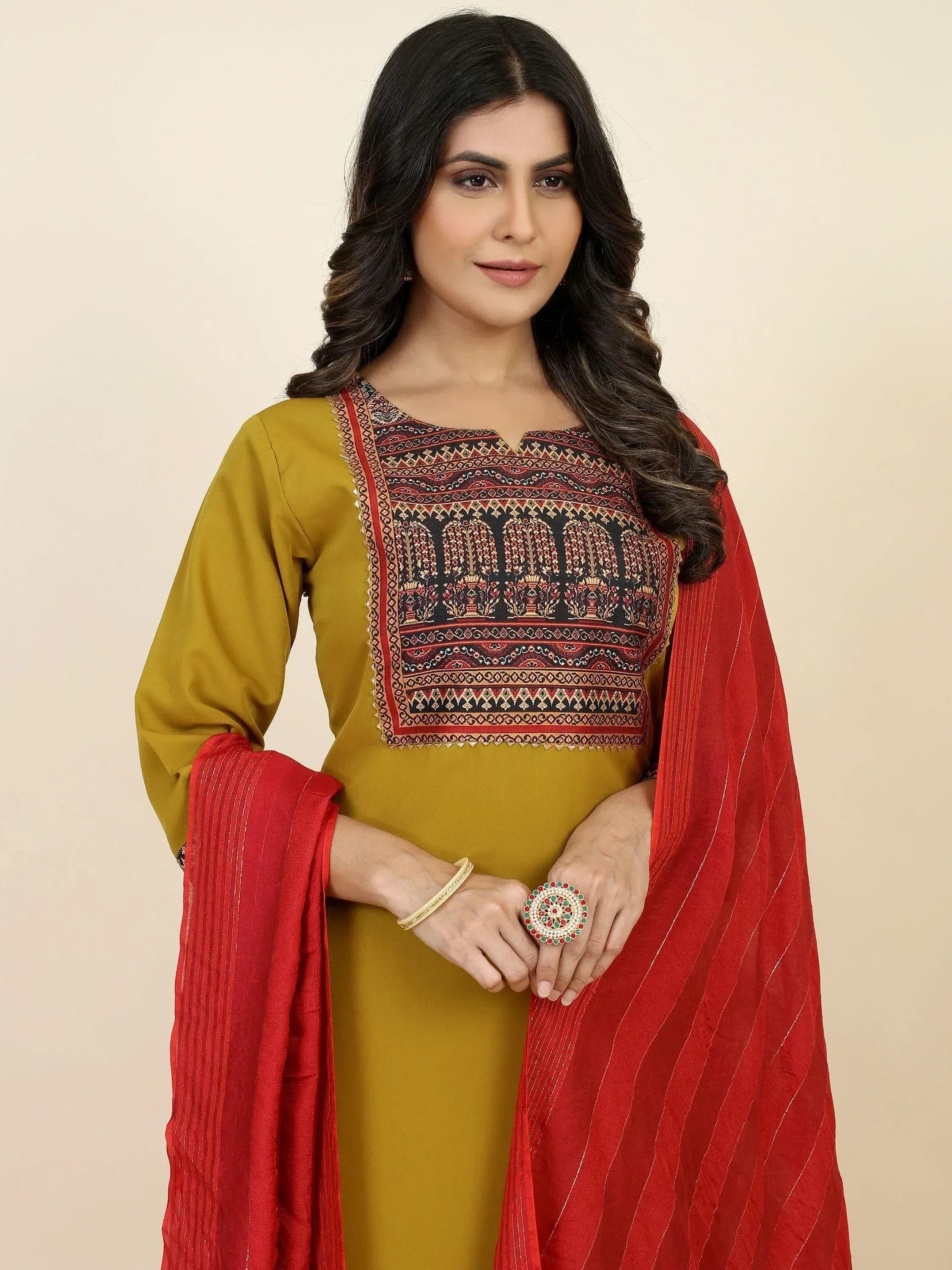 Mustard yellow kurta with embroidered yoke, paired with red striped dupatta, ethnic wear for women