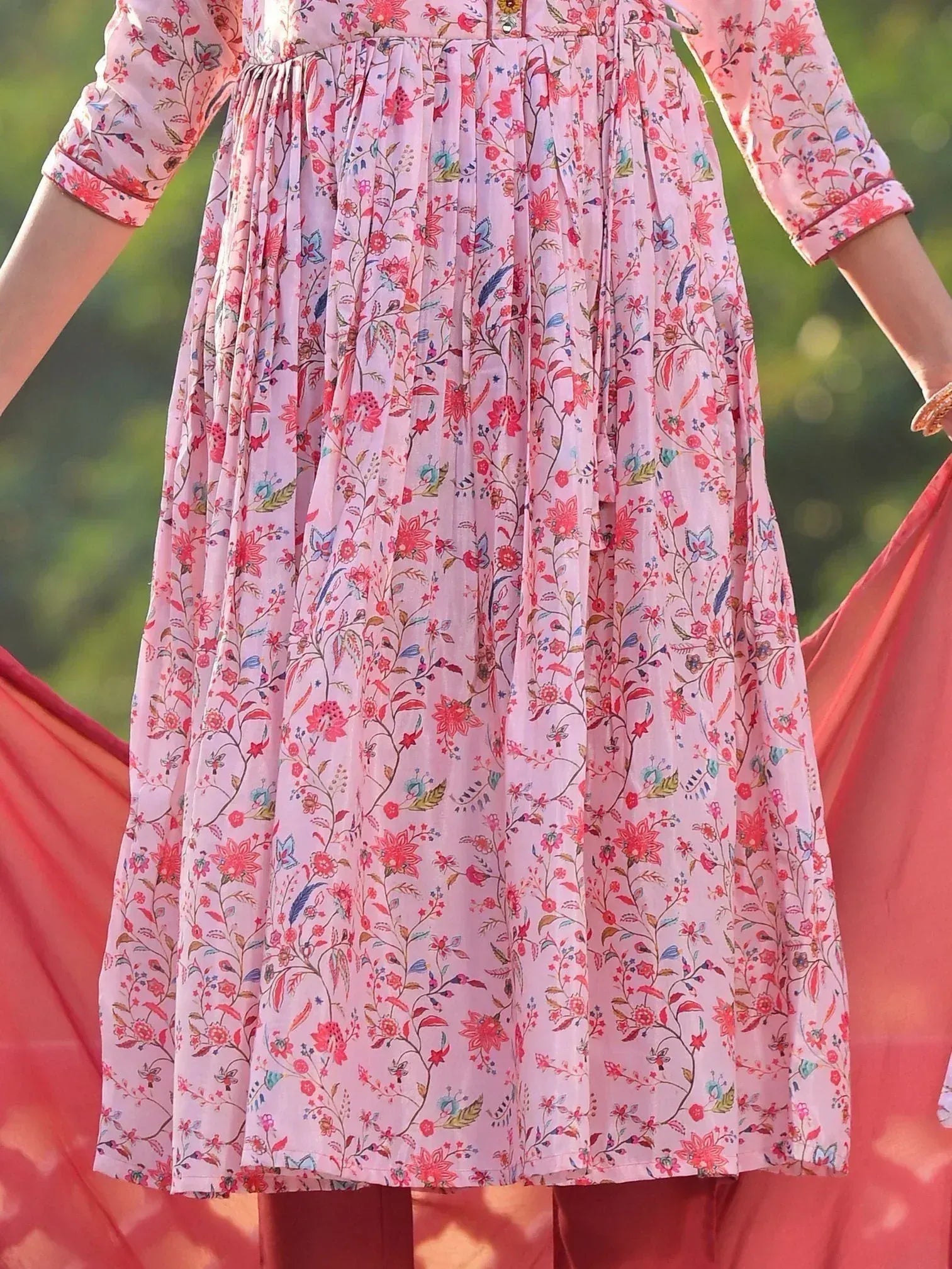 Pink floral print ethnic gown with pleated skirt and 3/4 sleeves, perfect for festive occasions