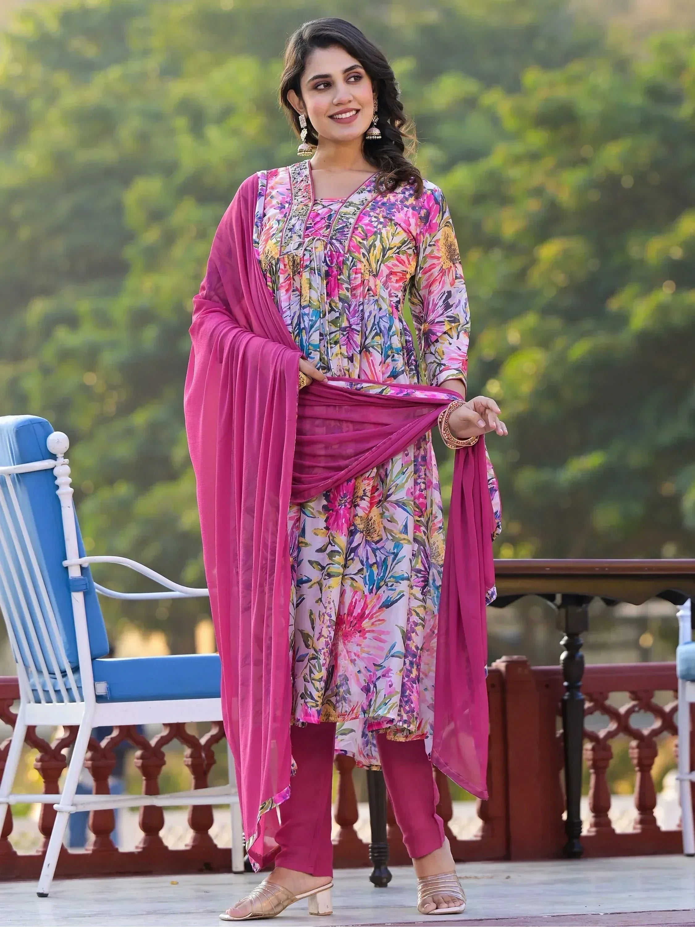 Woman in floral print salwar kameez with pink dupatta, ethnic wear for women