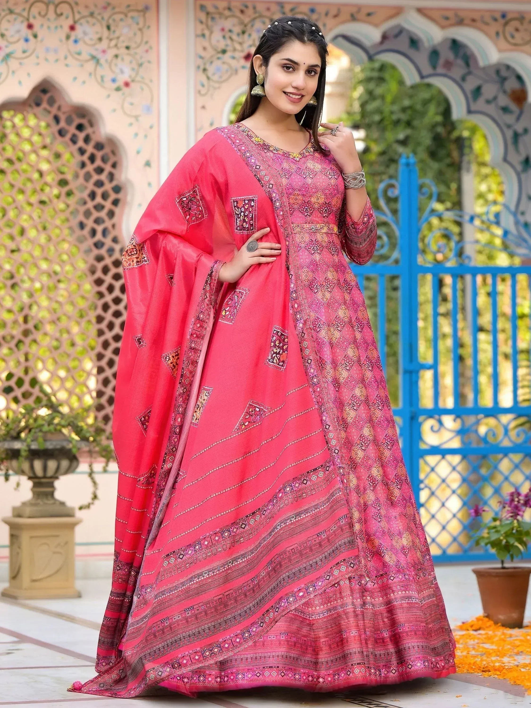 Pink printed anarkali suit with ethnic embroidery, perfect for Indian festivals and occasions