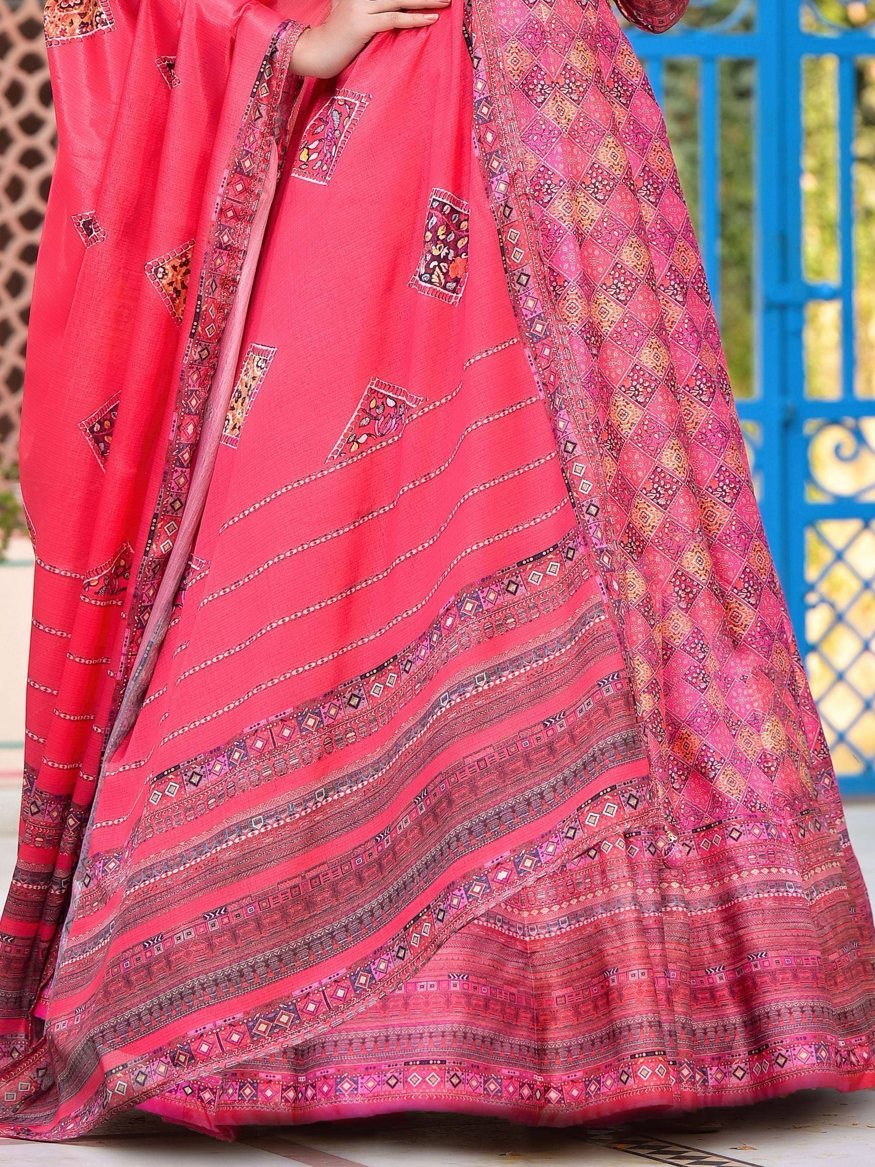 Vibrant pink ethnic lehenga with intricate geometric and floral prints, perfect for festive occasions.