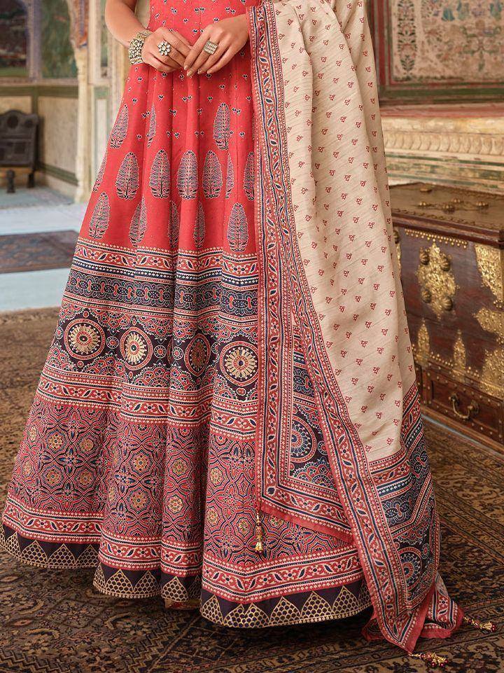 Red printed lehenga choli with ethnic motifs and matching dupatta, traditional Indian wedding attire