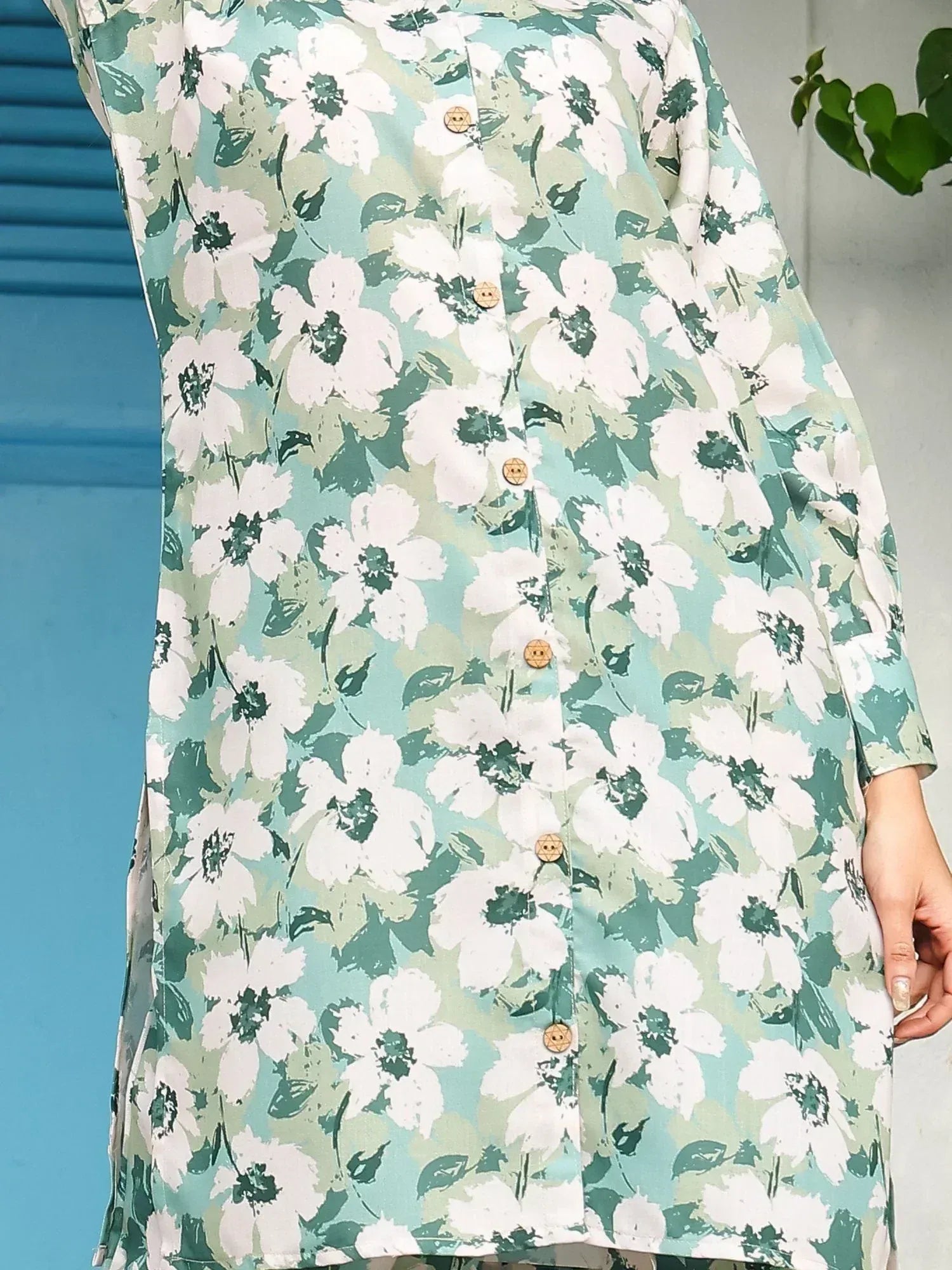 Floral print ethnic kurti with white flowers and green leaves, button front design