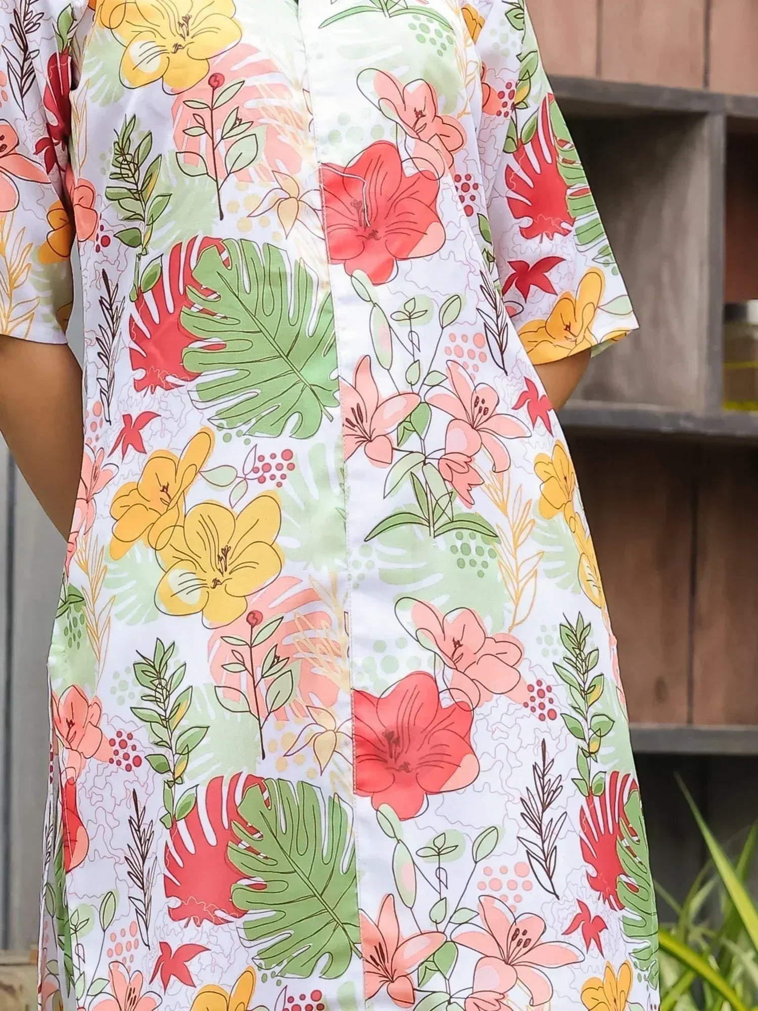 Floral print ethnic gown with vibrant hibiscus and monstera leaves, perfect for Indian wear