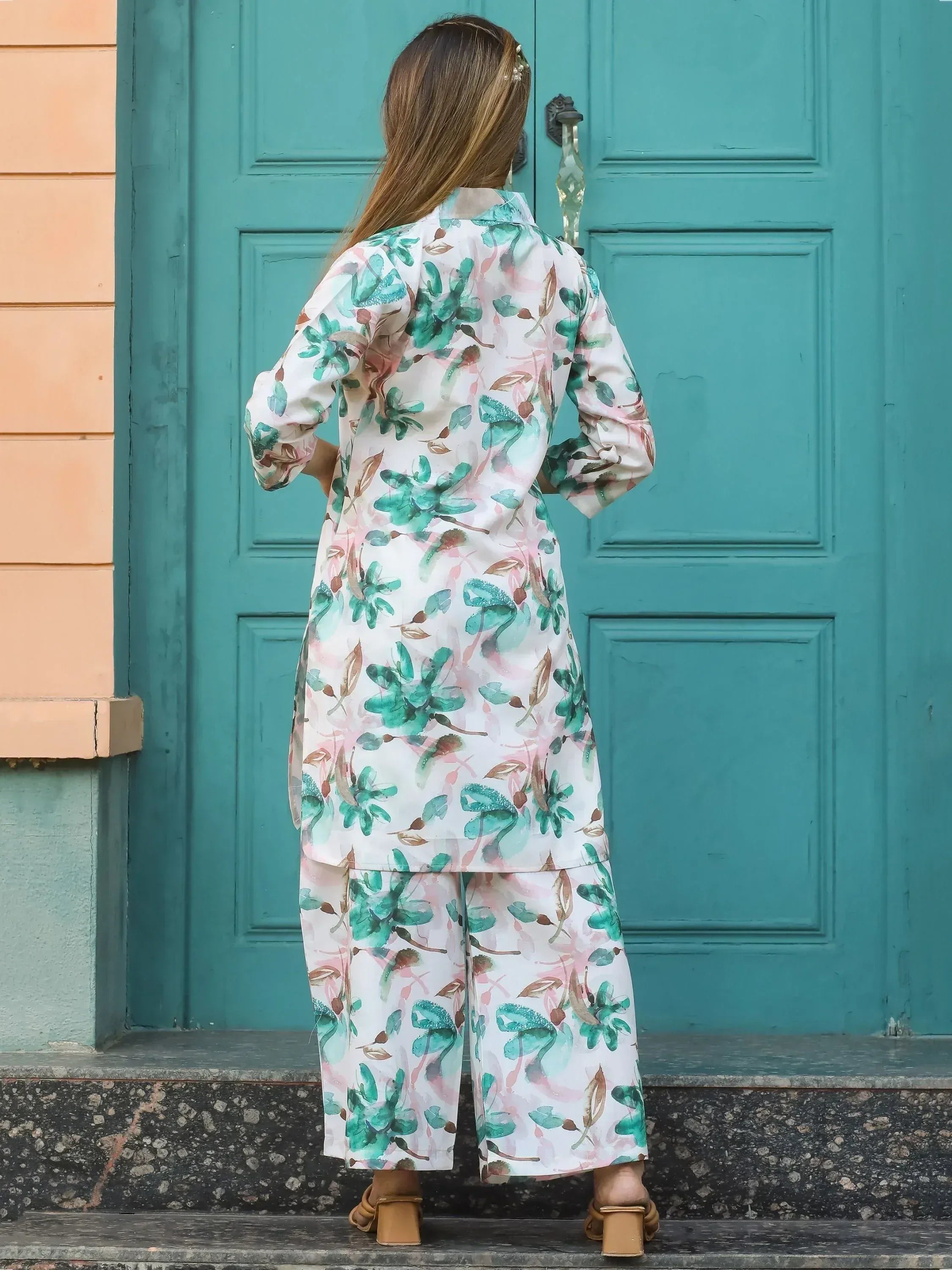 Floral print salwar kameez with green and pink botanical design, styled for ethnic wear