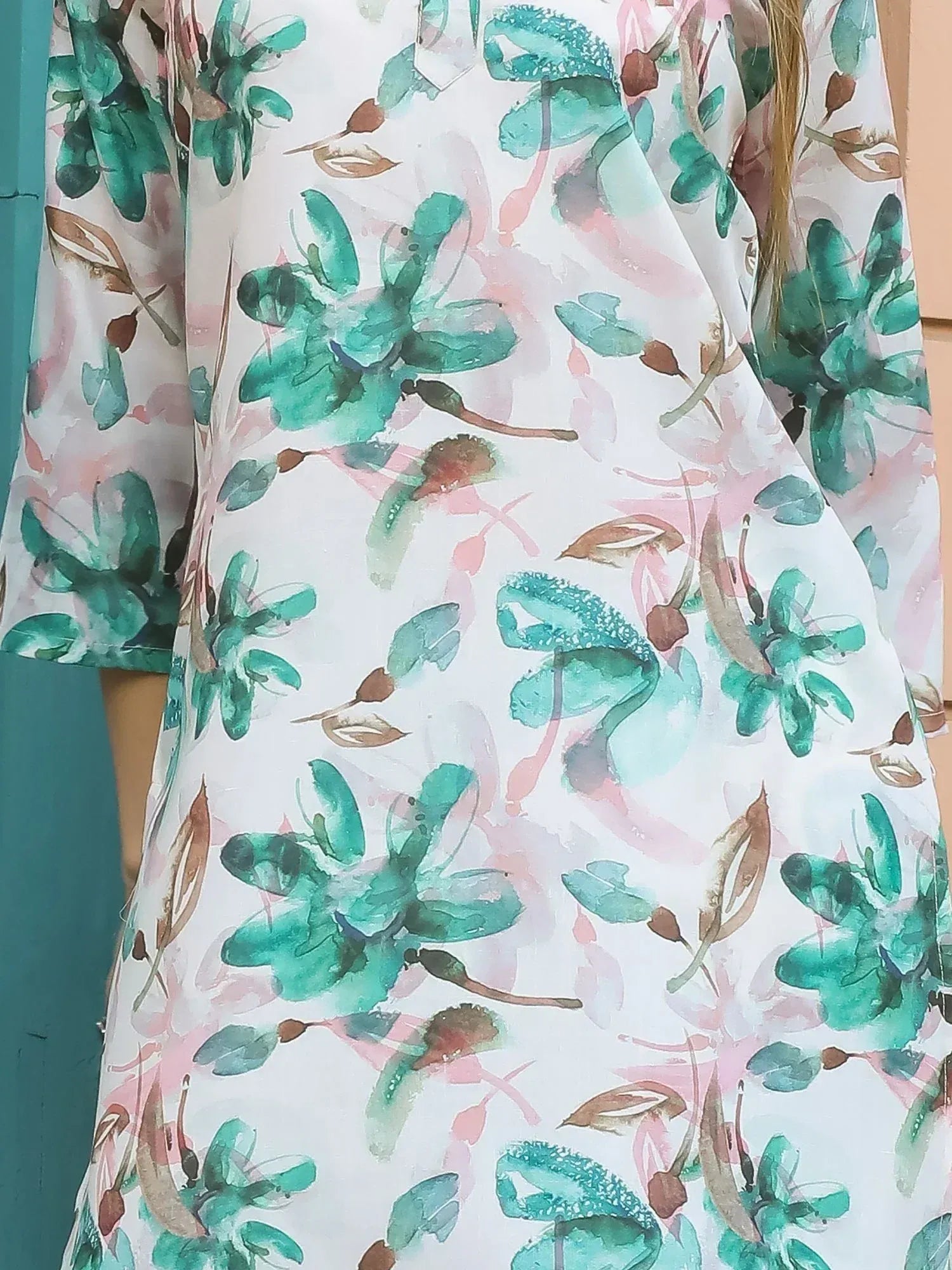 White ethnic gown with green and pink floral print, perfect for Indian occasions