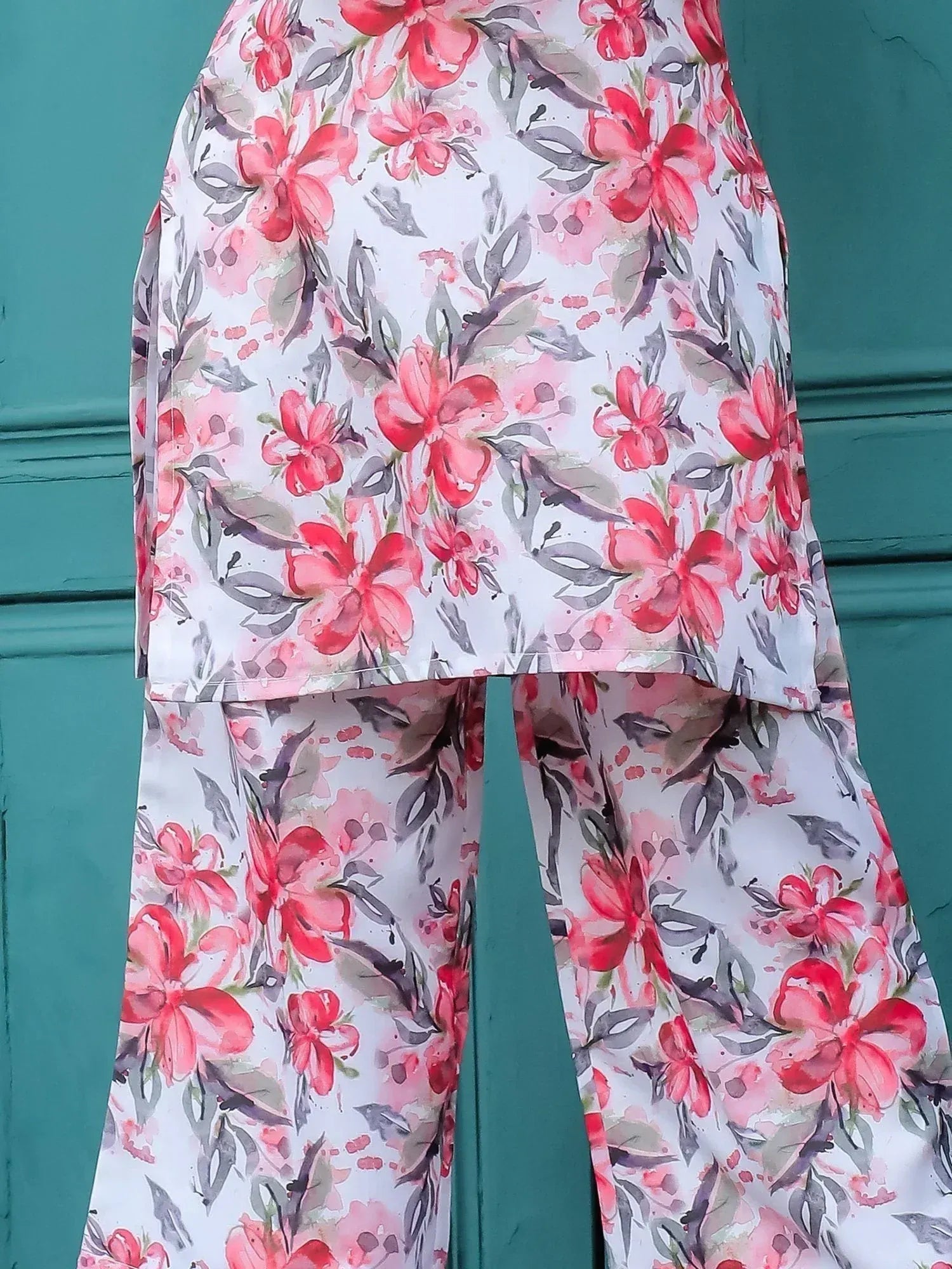 Floral print salwar kameez with pink and red blooms on white, perfect for ethnic wear