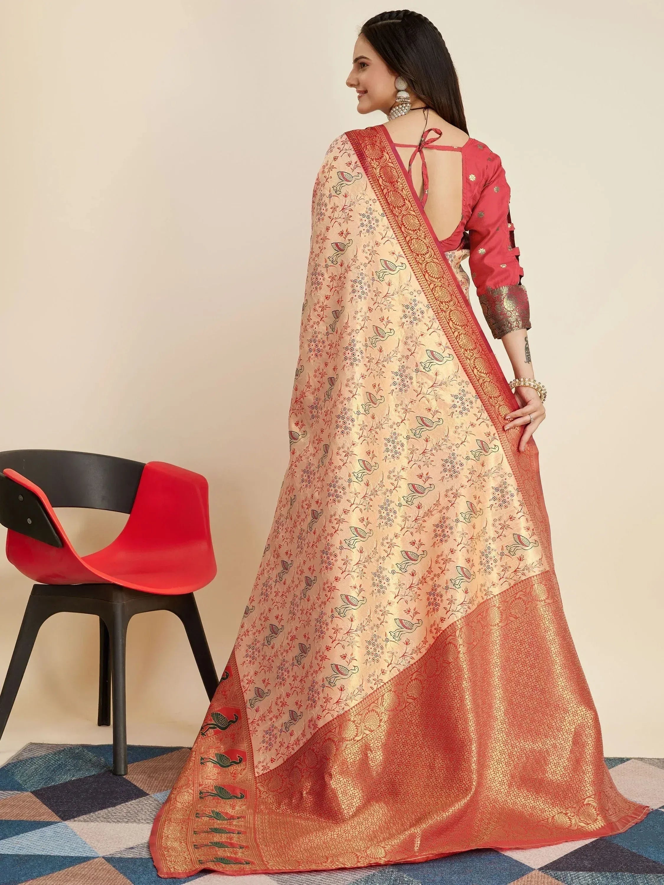 Woman in peach and coral printed ethnic gown with back tie detail, perfect for Indian occasions