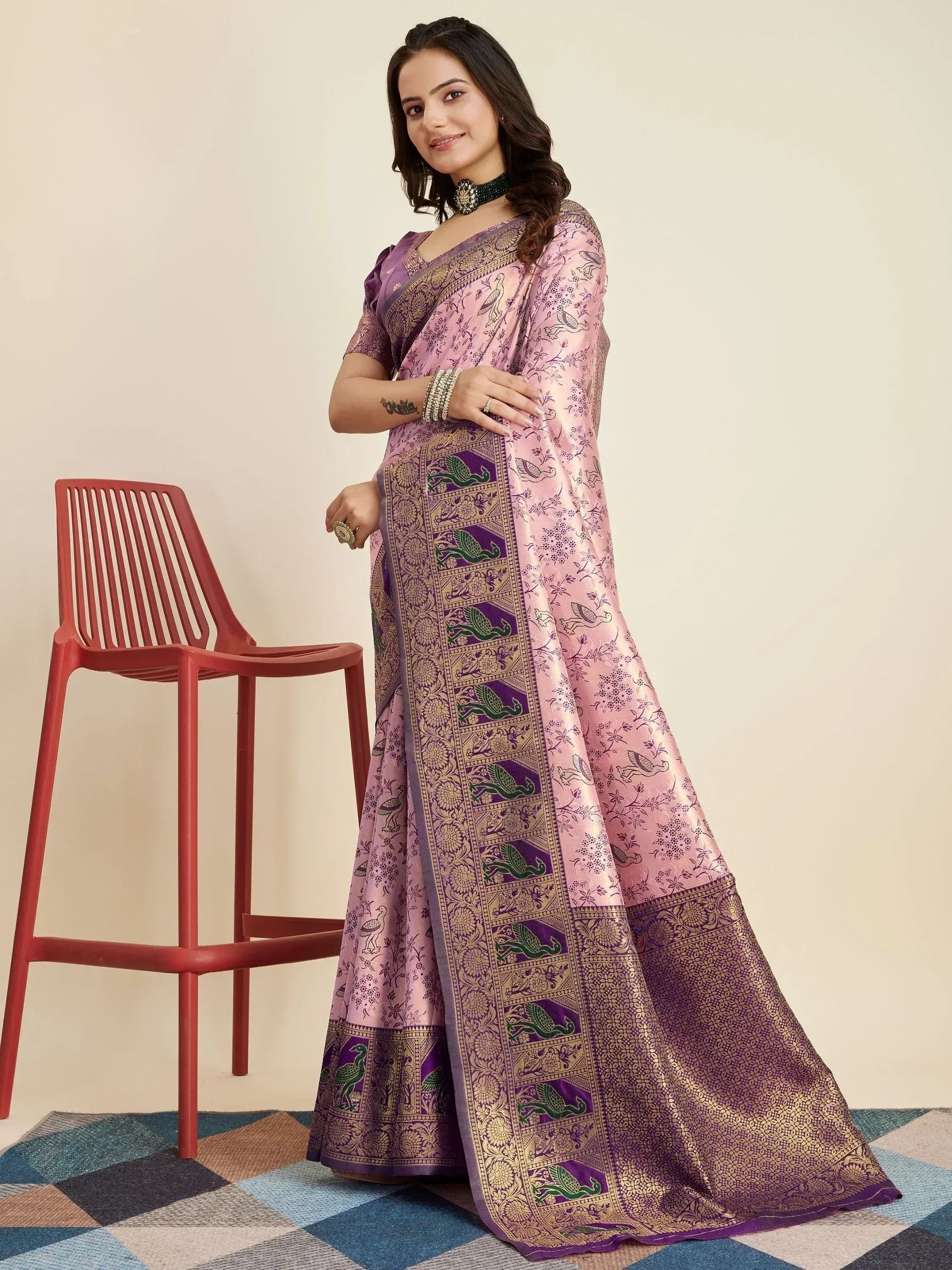 Woman in pink and purple designer saree with peacock print, ethnic wear for festive occasions