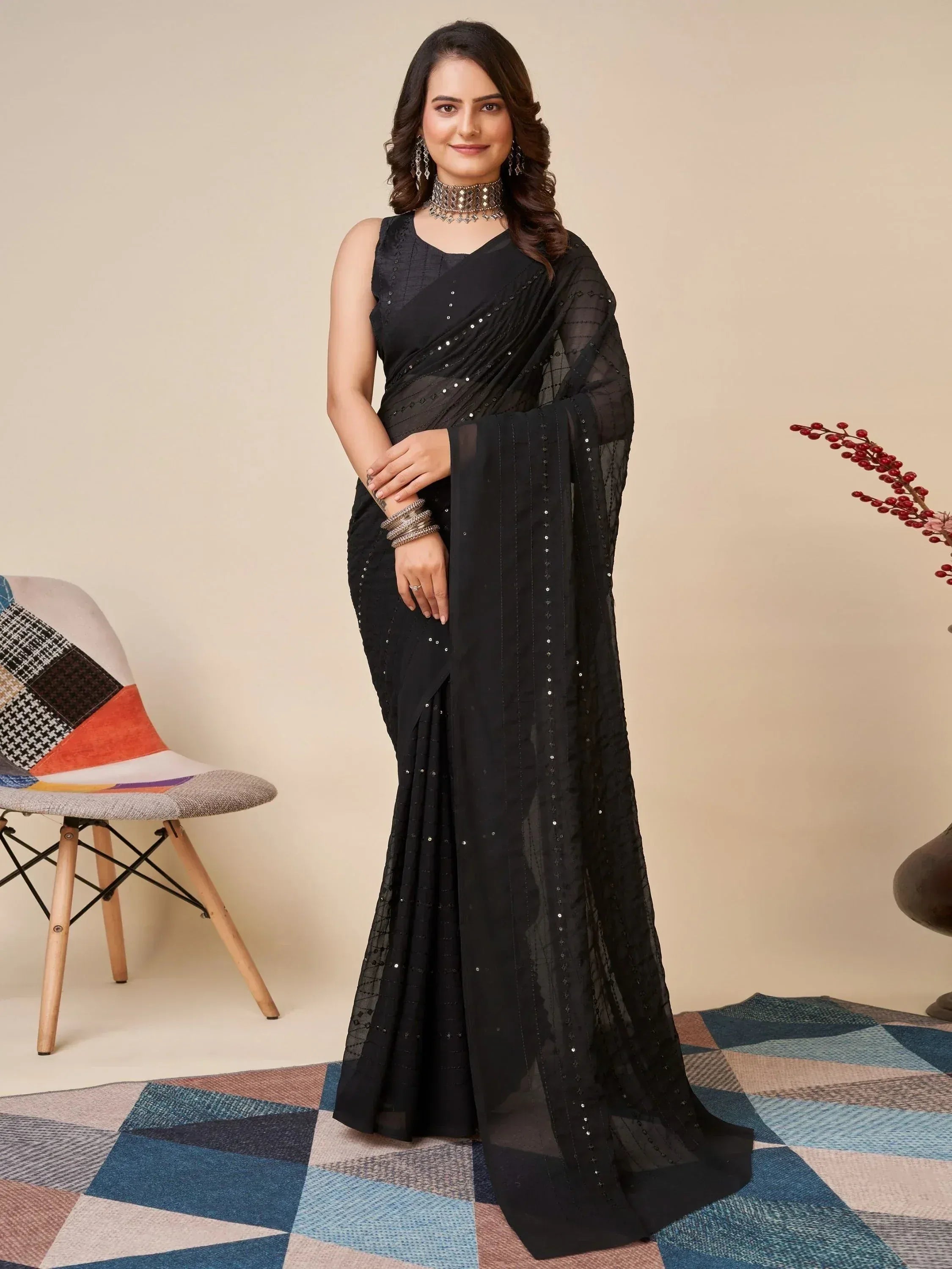 Elegant black sequin saree with sheer blouse, perfect for Indian ethnic wear occasions