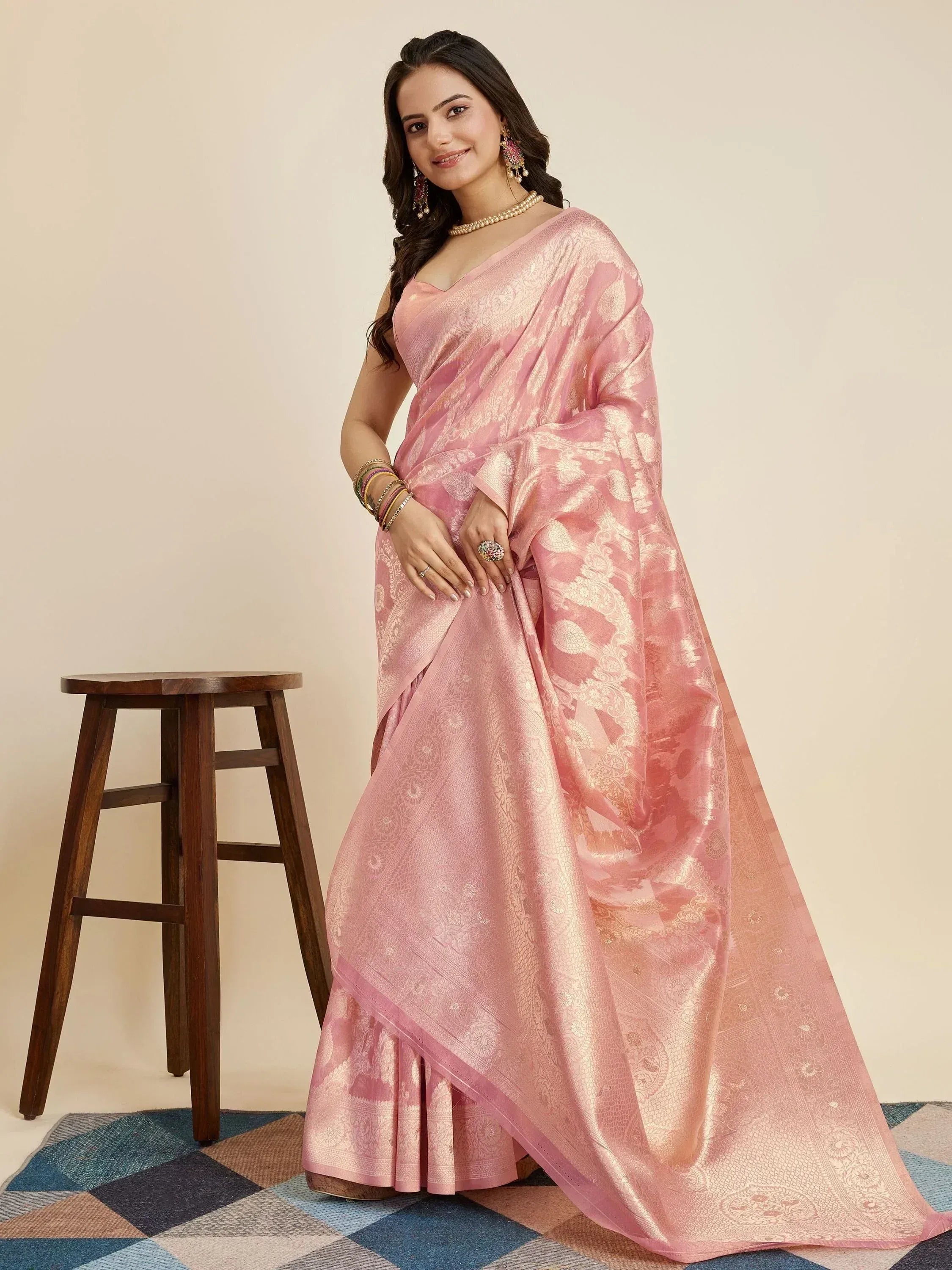 Pink designer saree with gold paisley weave, perfect for ethnic occasions and festive wear