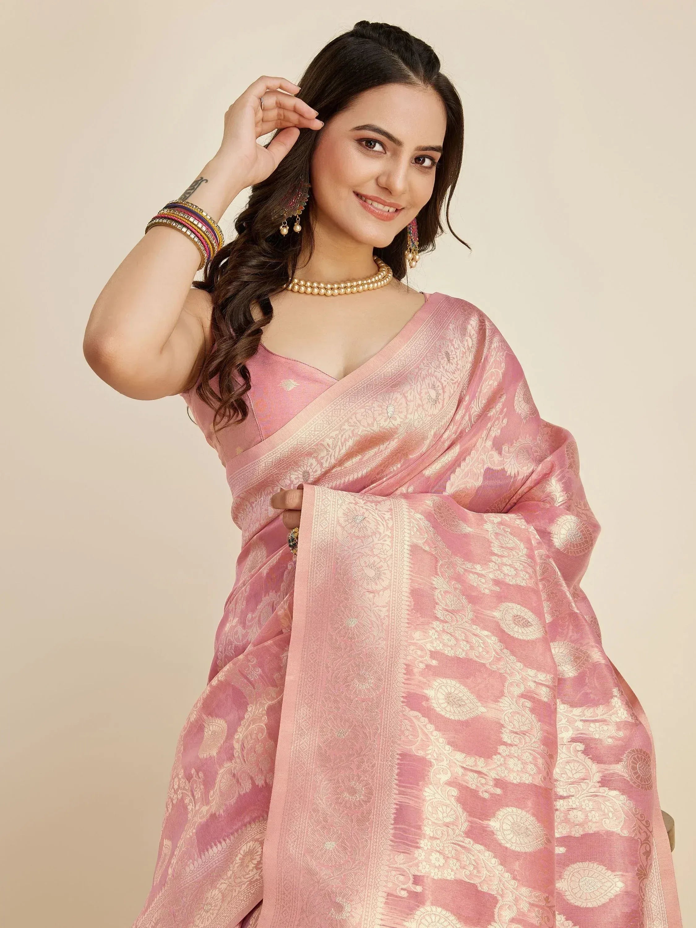 Pink designer saree with gold floral weave, perfect for Indian ethnic wear occasions