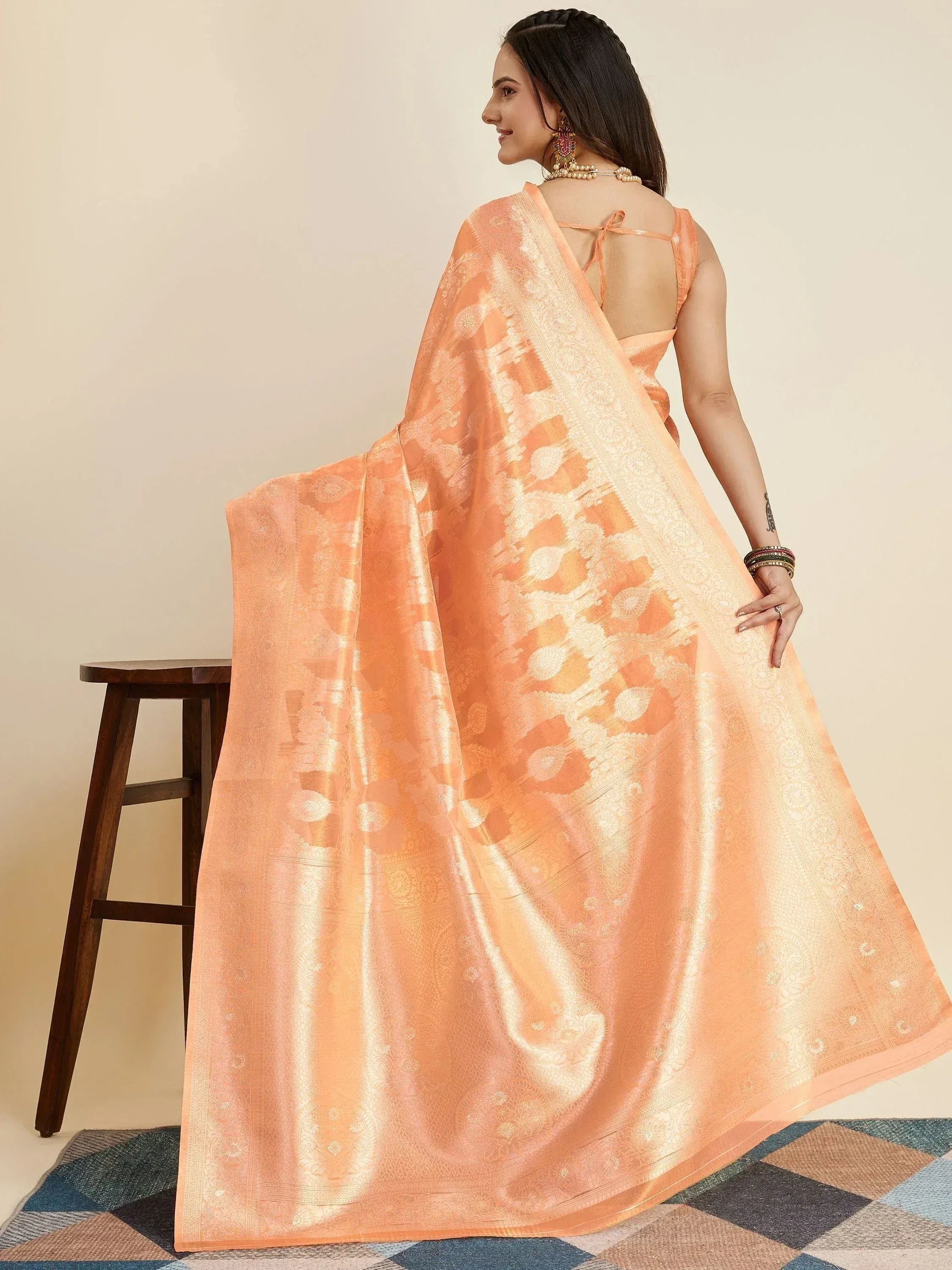 Peach designer saree with gold zari work, back view, ethnic wear for women