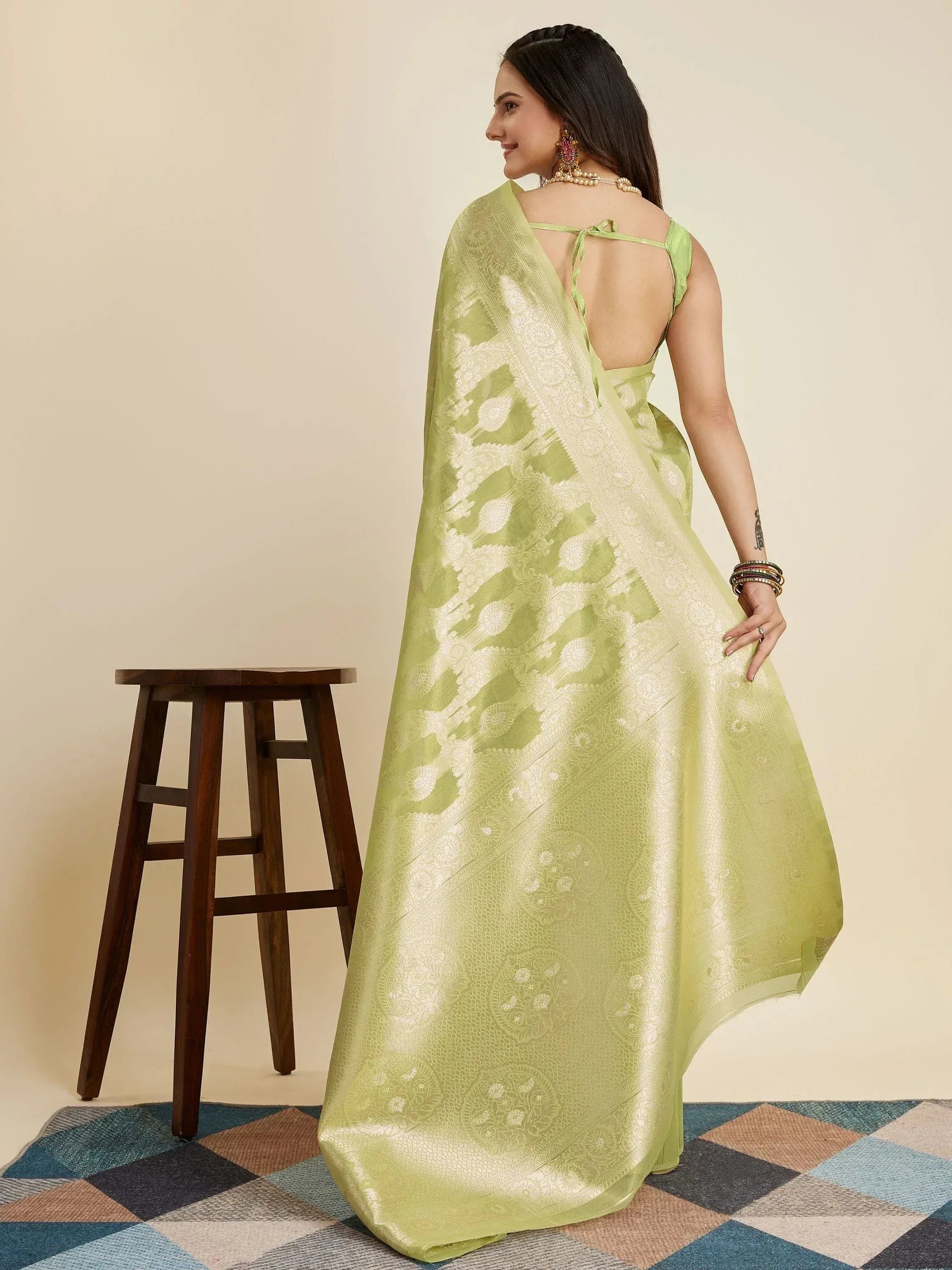 Light green designer saree with white floral motifs, backless blouse, perfect for Indian ethnic wear