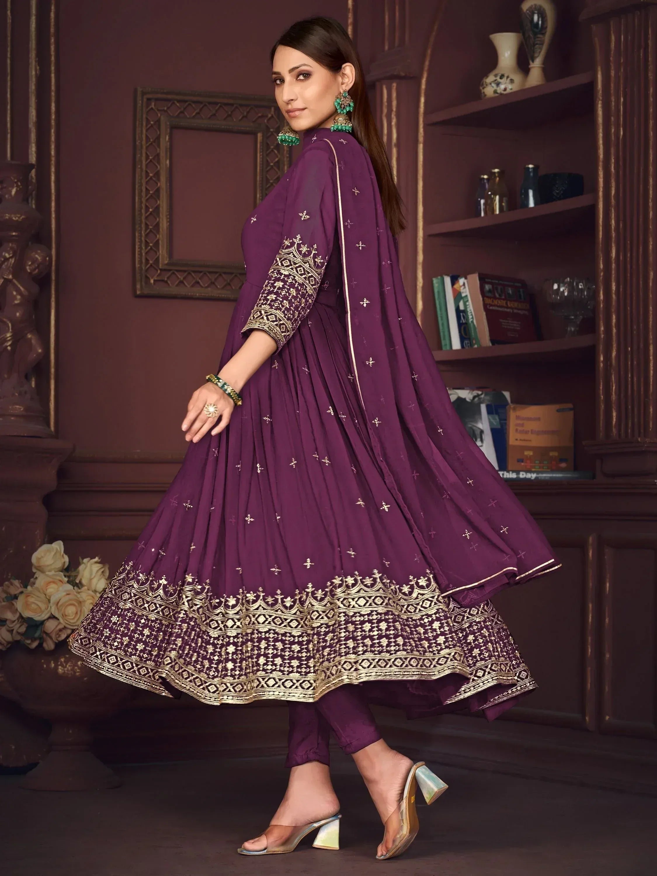 Purple ethnic anarkali suit with gold embroidery, perfect for Indian festive occasions and weddings.