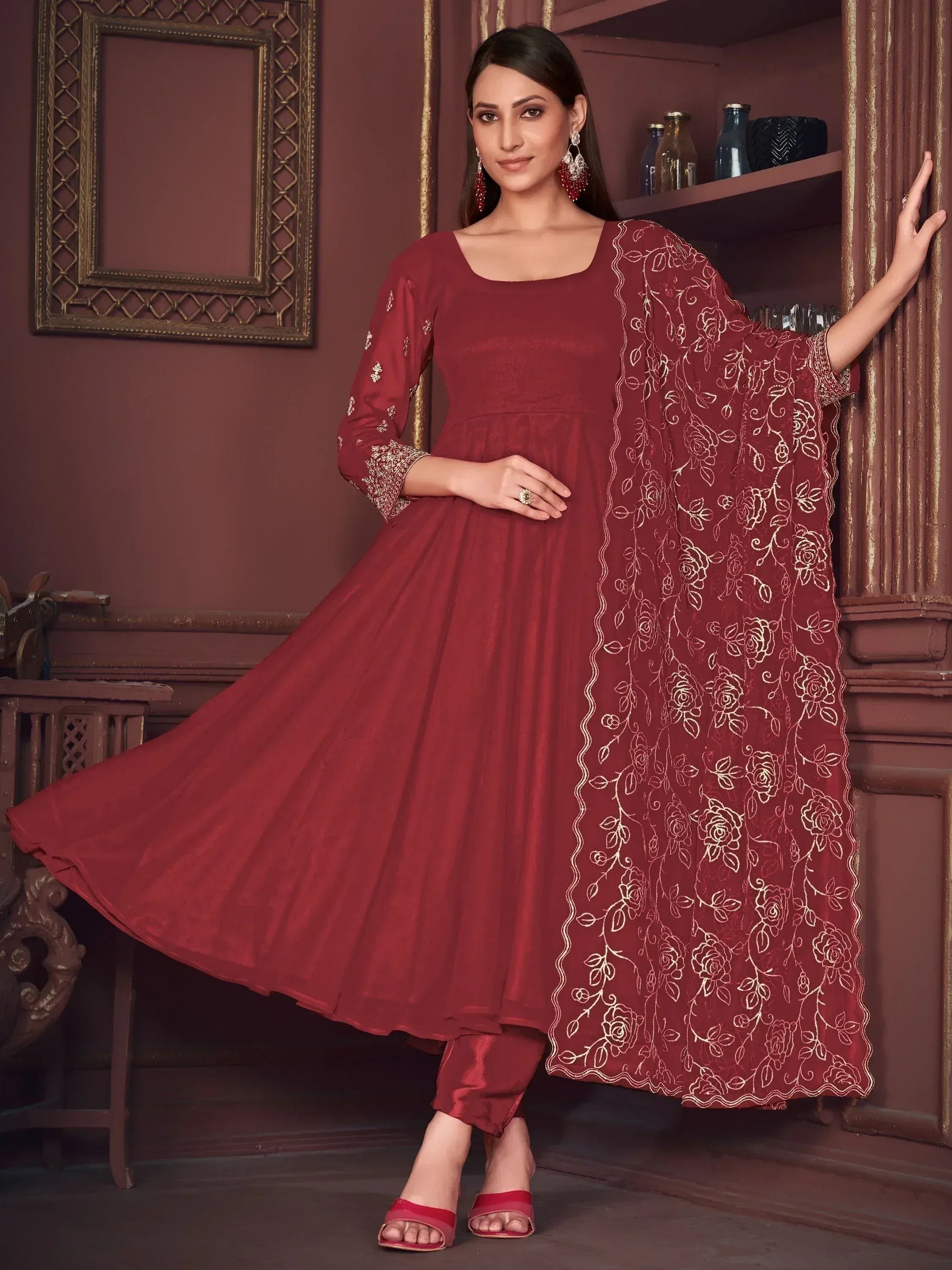 Maroon ethnic anarkali suit with gold floral embroidery, perfect for Indian occasions and festive wear.