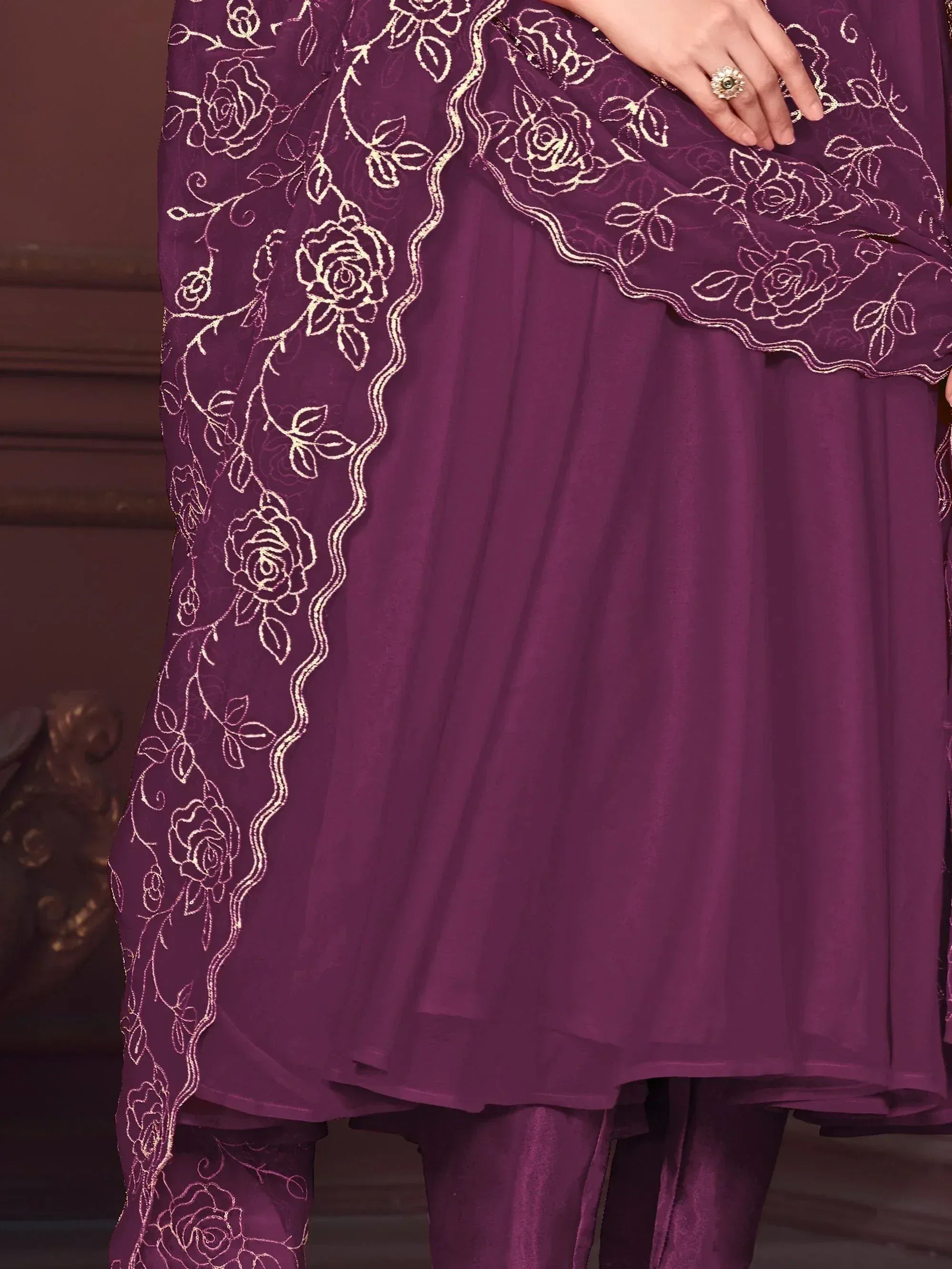 Purple ethnic salwar kameez with gold floral embroidery and sheer dupatta, perfect for festive occasions