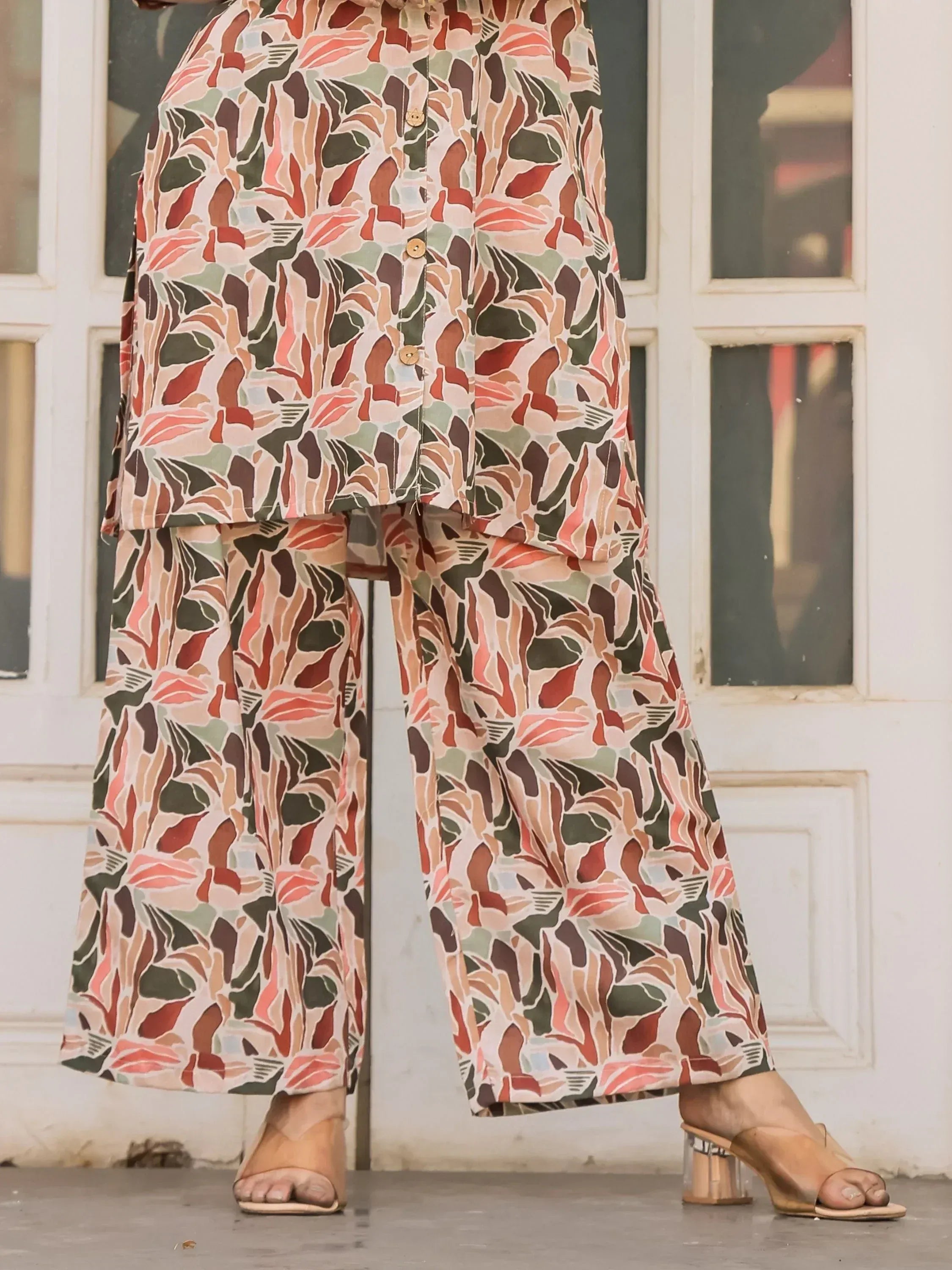 Floral print ethnic palazzo suit with button front top and wide-leg pants, perfect for casual wear.