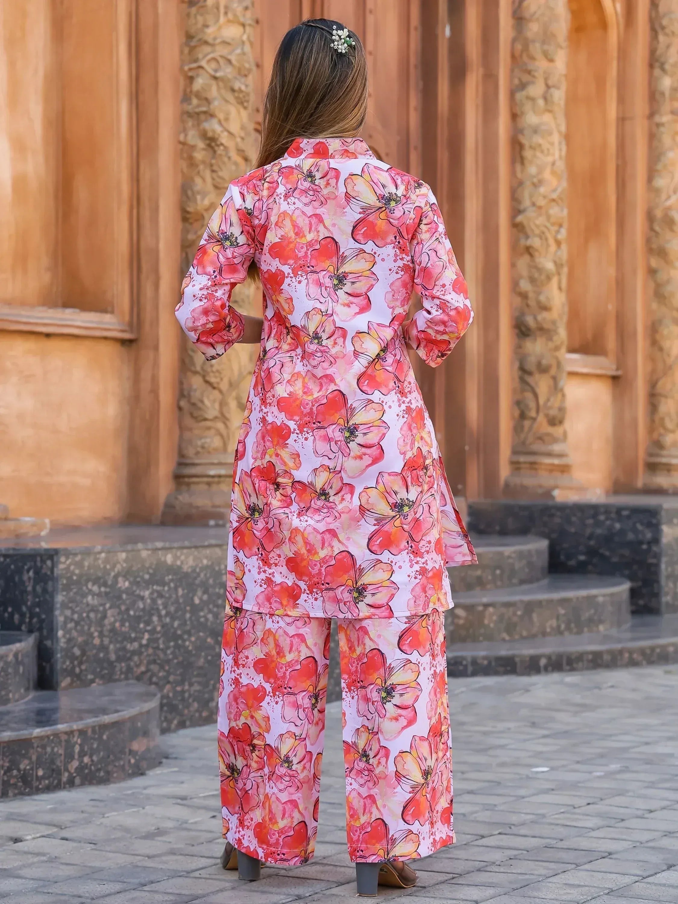 Woman in floral print Indian ethnic kurta set with palazzo pants, back view