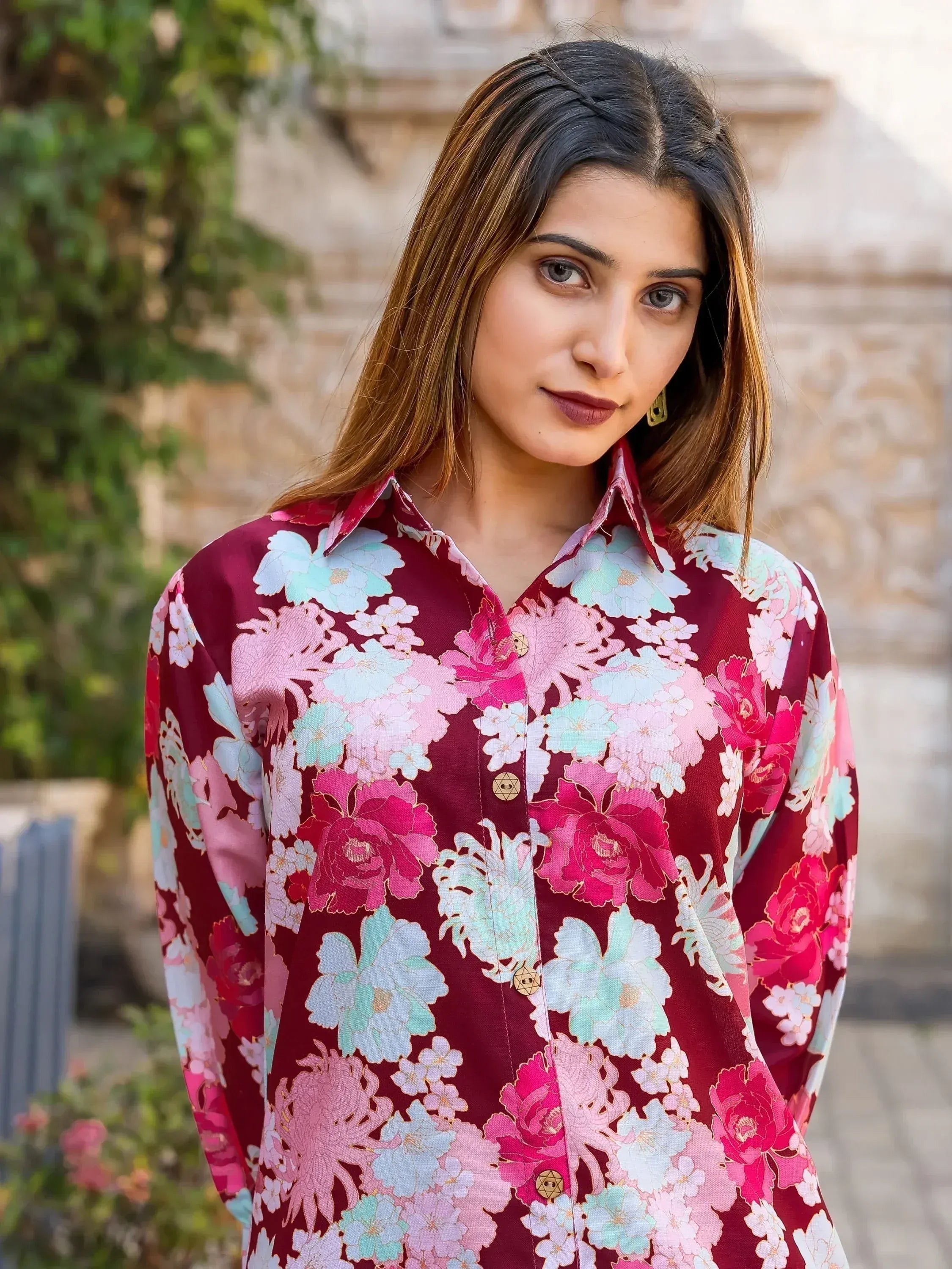 Woman in maroon floral print ethnic kurta with pink and mint flowers, perfect for Indian wear