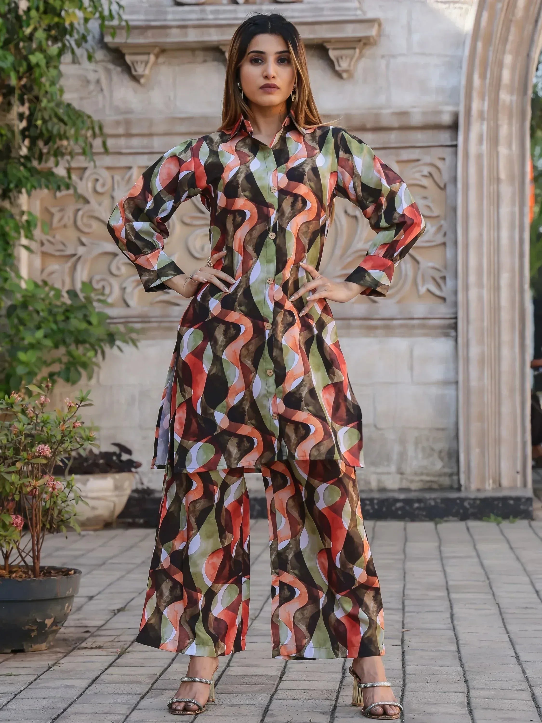 Woman in trendy printed salwar kameez with abstract pattern, ethnic wear for women