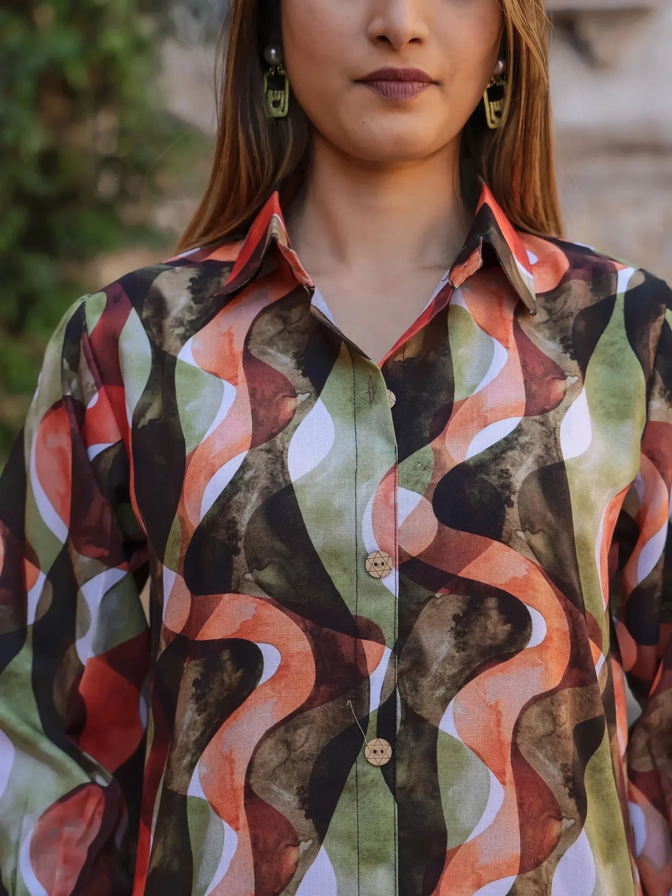 Woman wearing abstract print ethnic shirt with wooden buttons, stylish Indian wear