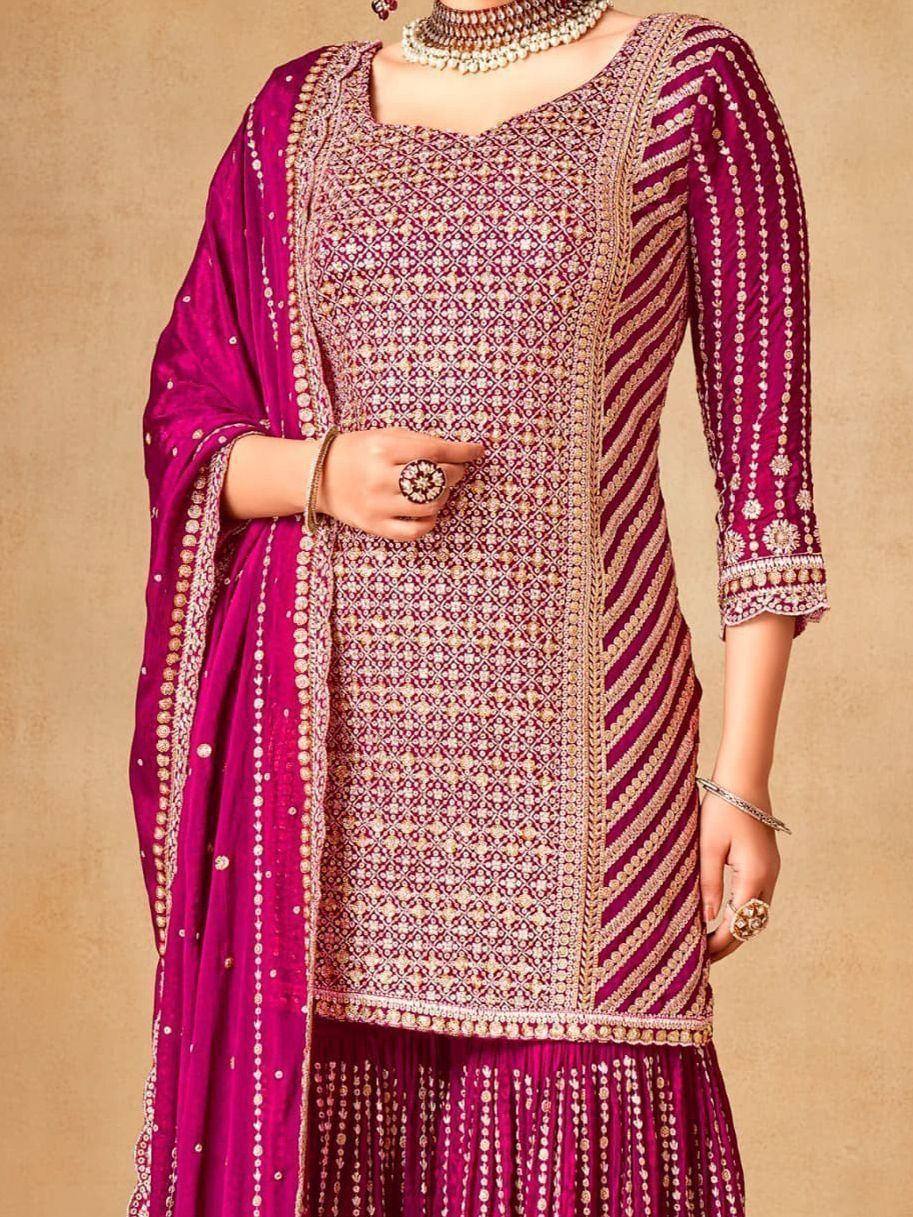Elegant maroon embroidered salwar kameez with gold detailing, perfect for festive occasions
