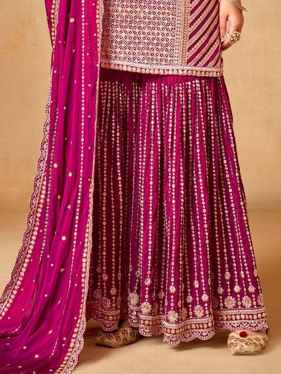 Magenta embroidered lehenga choli with gold detailing, perfect for weddings and festivals