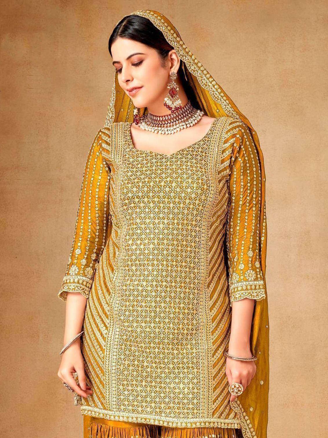 Elegant mustard yellow ethnic salwar kameez with intricate embroidery and matching dupatta