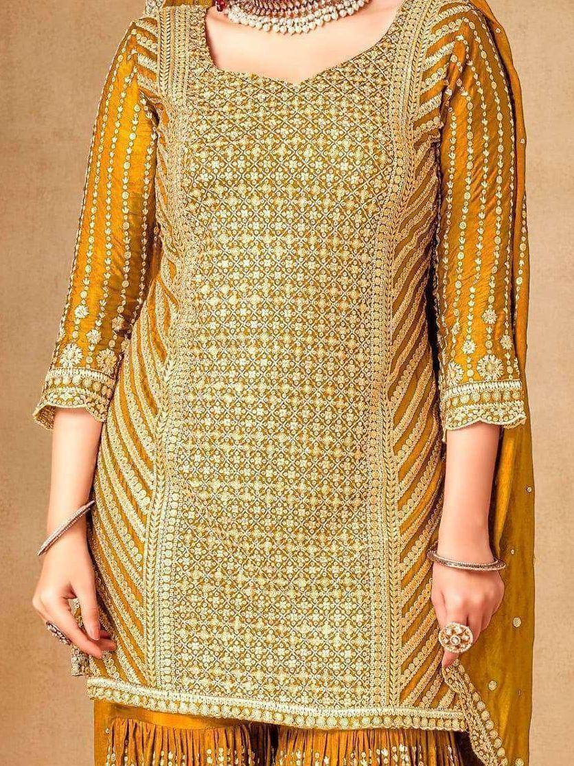 Golden embroidered ethnic kurti with intricate patterns and matching dupatta