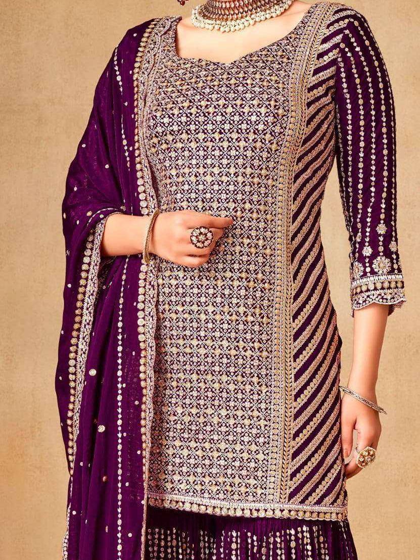 Elegant purple embroidered salwar kameez with intricate gold detailing and matching dupatta