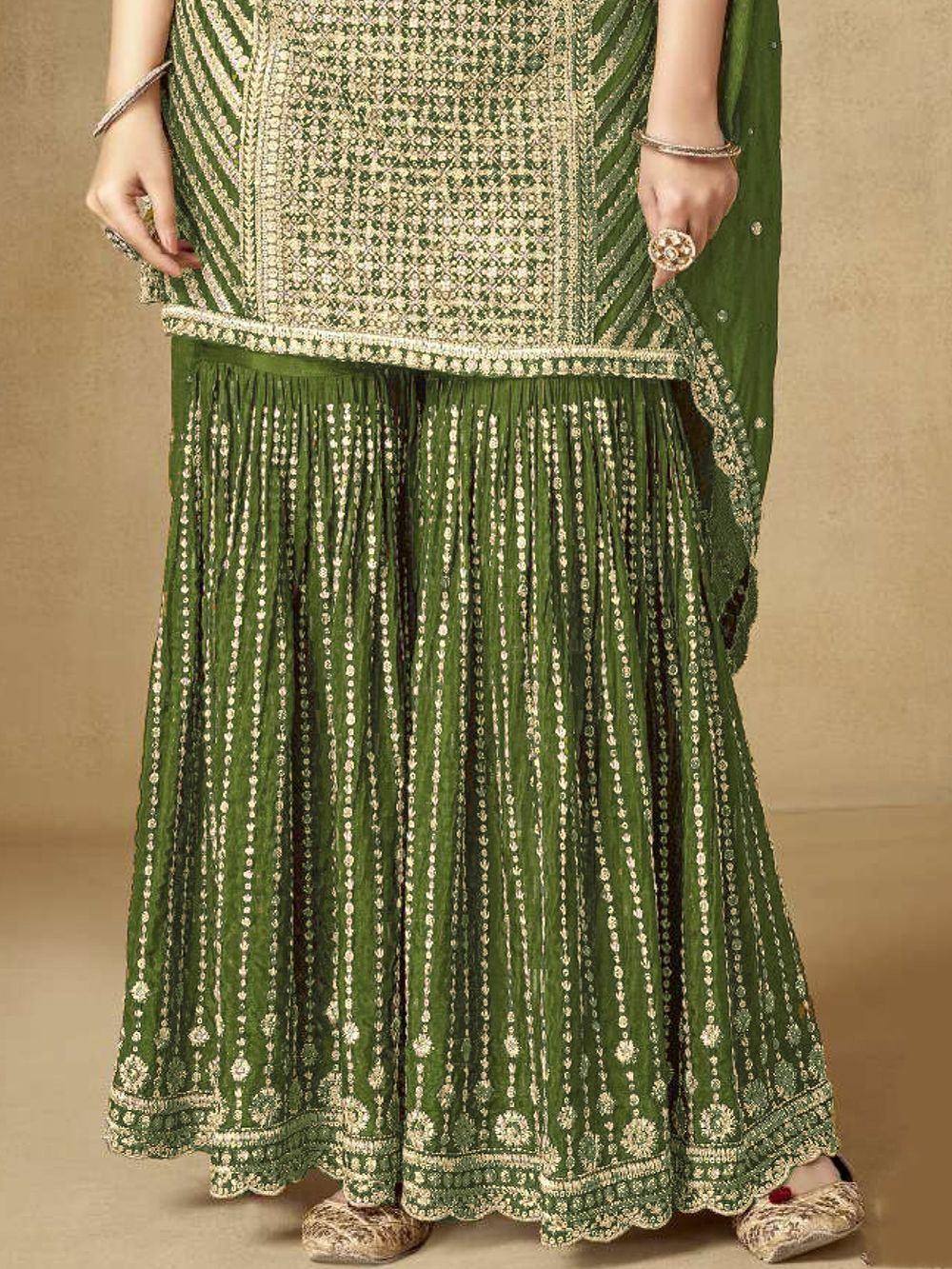 Green embroidered lehenga choli with gold detailing, perfect for ethnic occasions