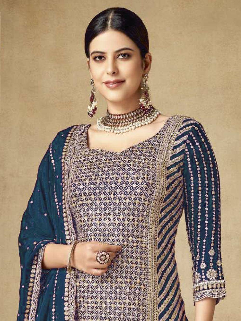 Elegant navy blue embroidered salwar kameez with matching dupatta and traditional jewelry