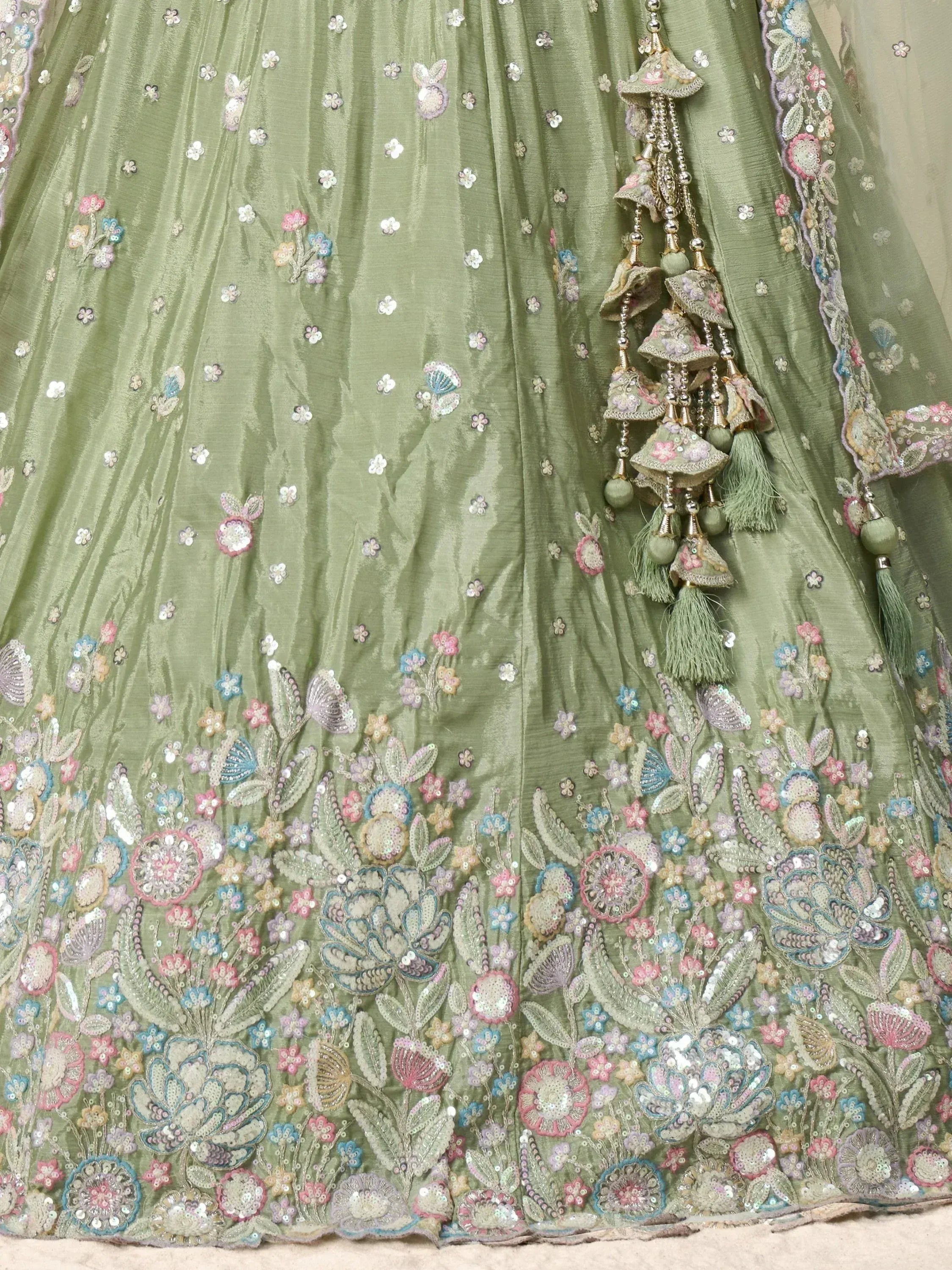 Olive green lehenga with floral embroidery, sequins, and tassels for Indian ethnic wear
