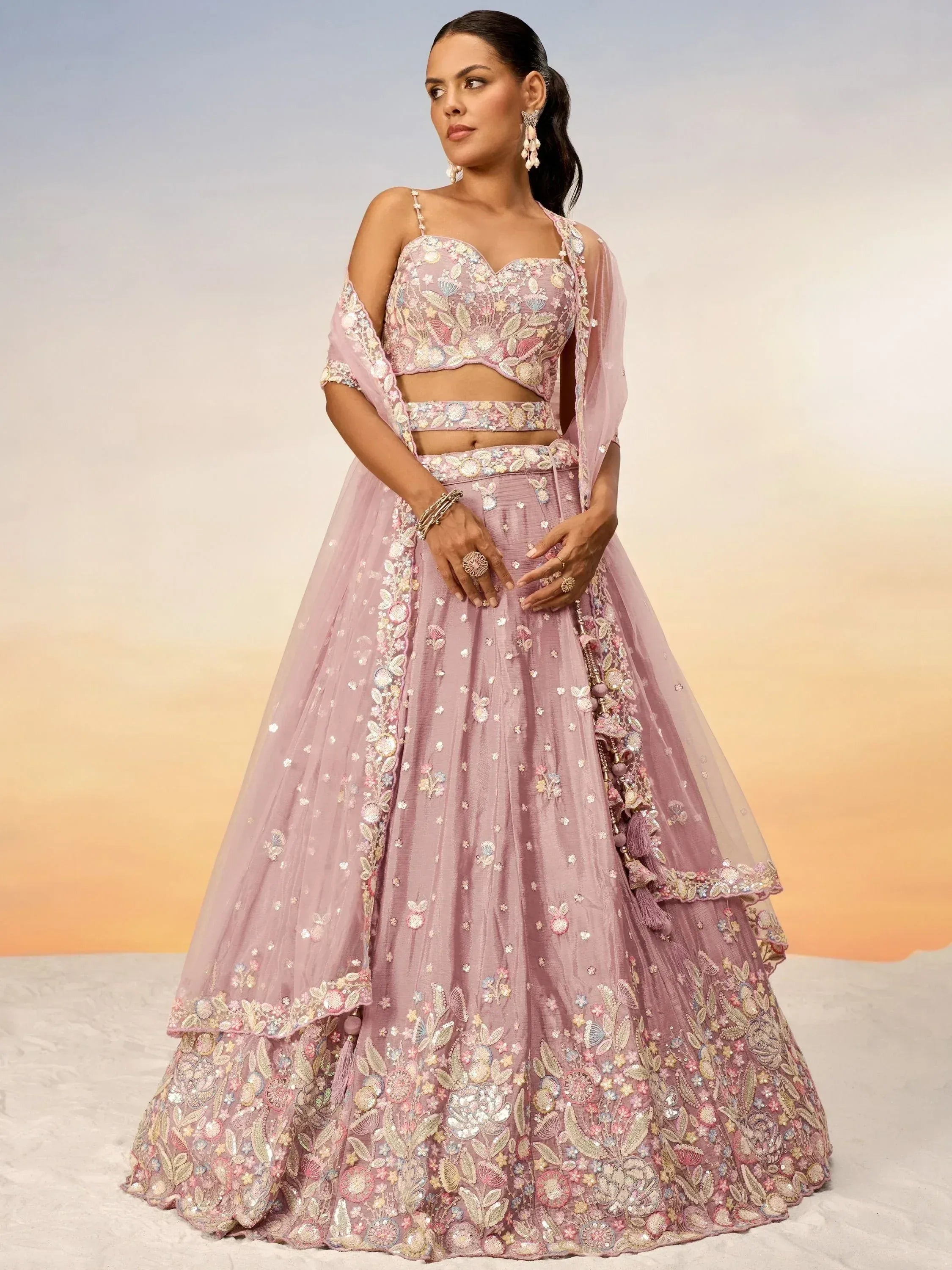Pink floral embroidered lehenga choli with sheer dupatta, perfect for Indian weddings and festive occasions.