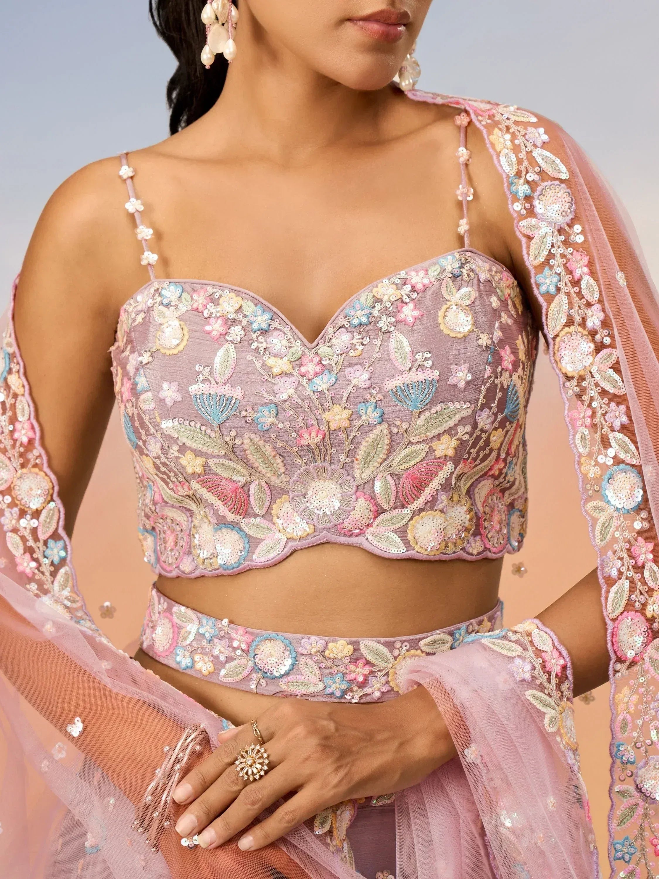 Pink floral embroidered lehenga choli with sheer dupatta, perfect for Indian ethnic wear events