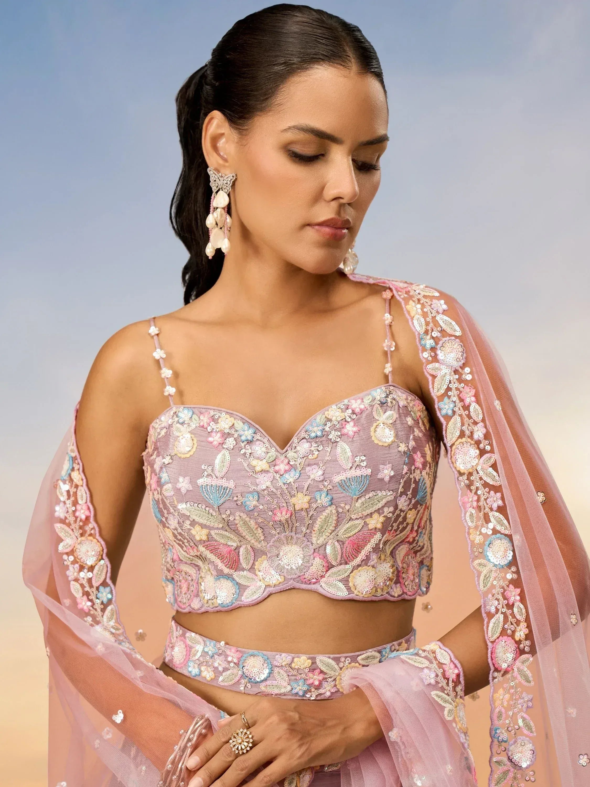 Pink floral embroidered lehenga choli with sheer dupatta, perfect for Indian ethnic wear occasions