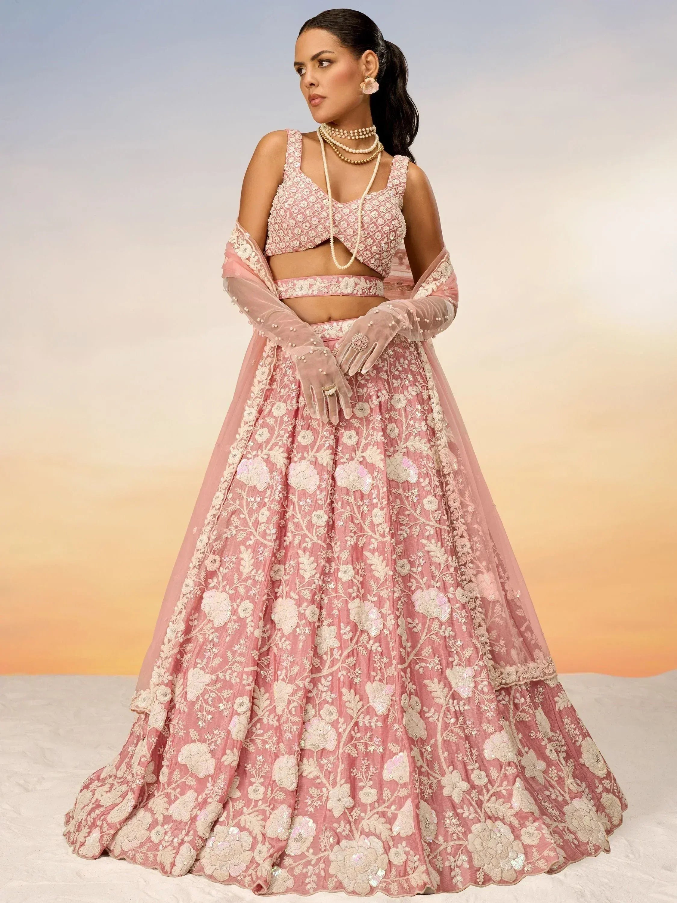 Pink floral embroidered lehenga choli with sheer dupatta, perfect for Indian weddings and festive occasions