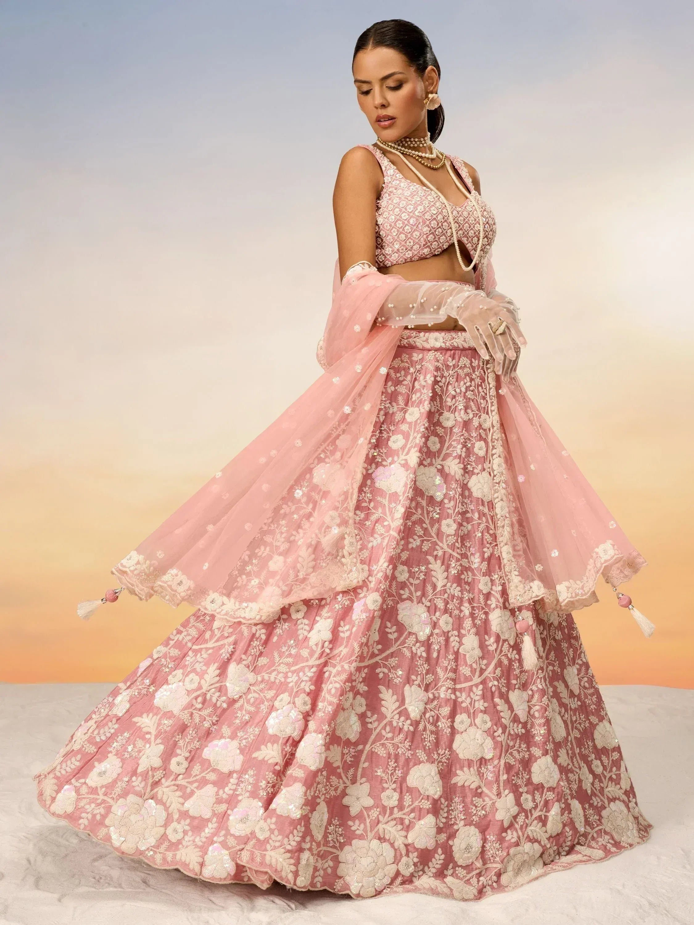 Pink floral embroidered lehenga choli with sheer dupatta, perfect for Indian weddings and festive occasions