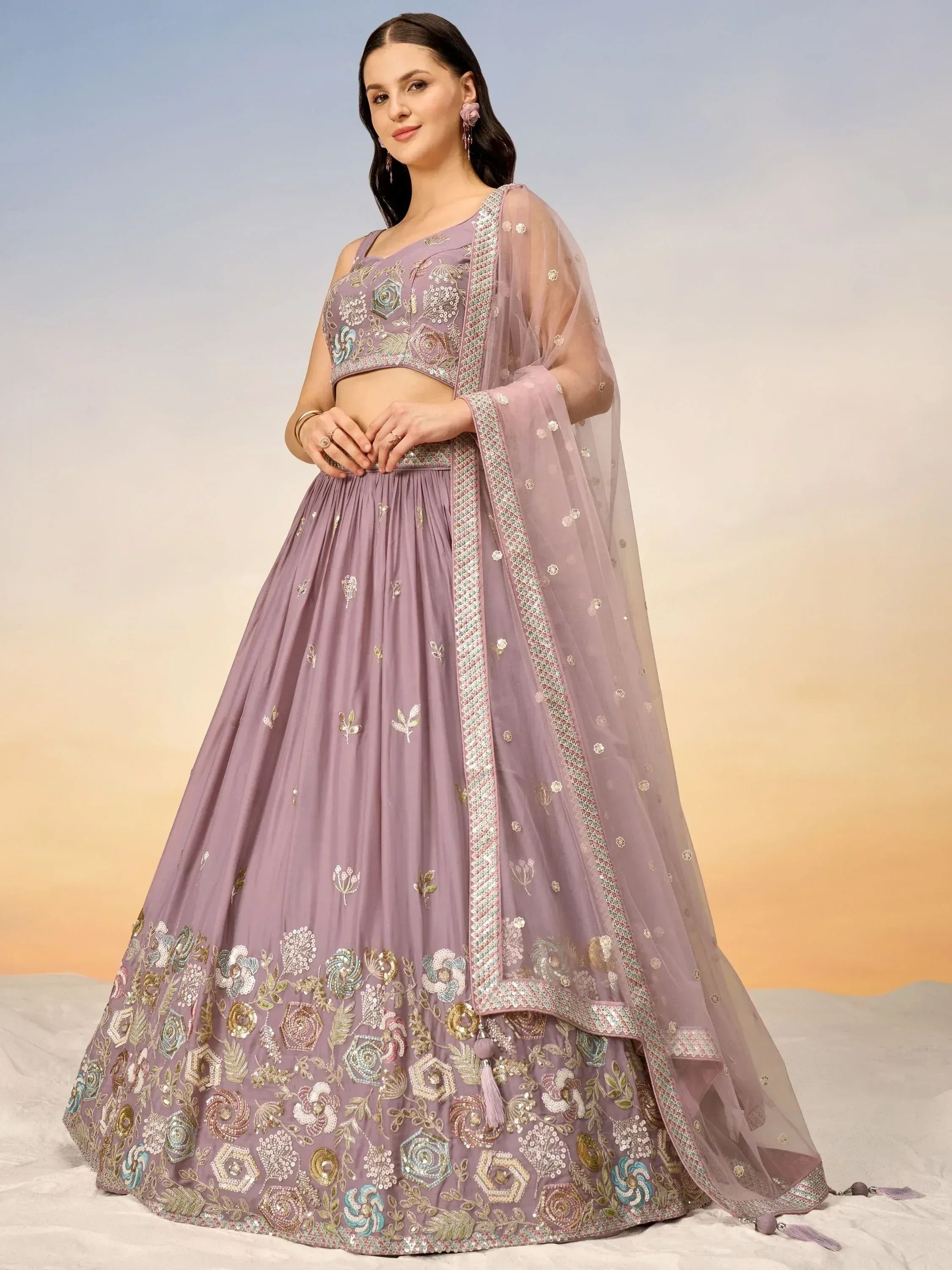 Elegant lavender lehenga choli with intricate floral embroidery and sheer dupatta for Indian ethnic wear