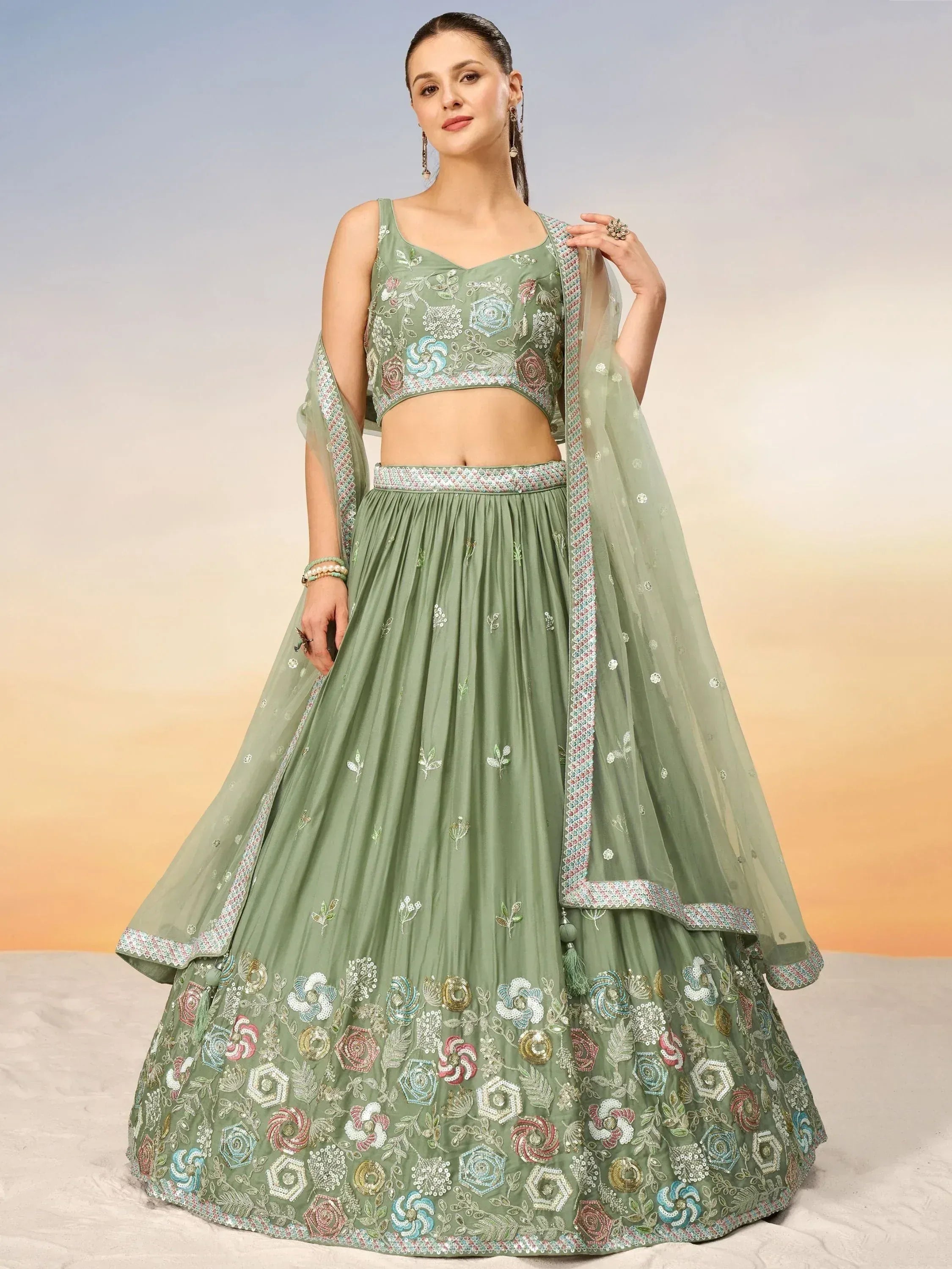 Mint green embroidered lehenga choli with floral motifs and matching dupatta, perfect for Indian ethnic occasions.