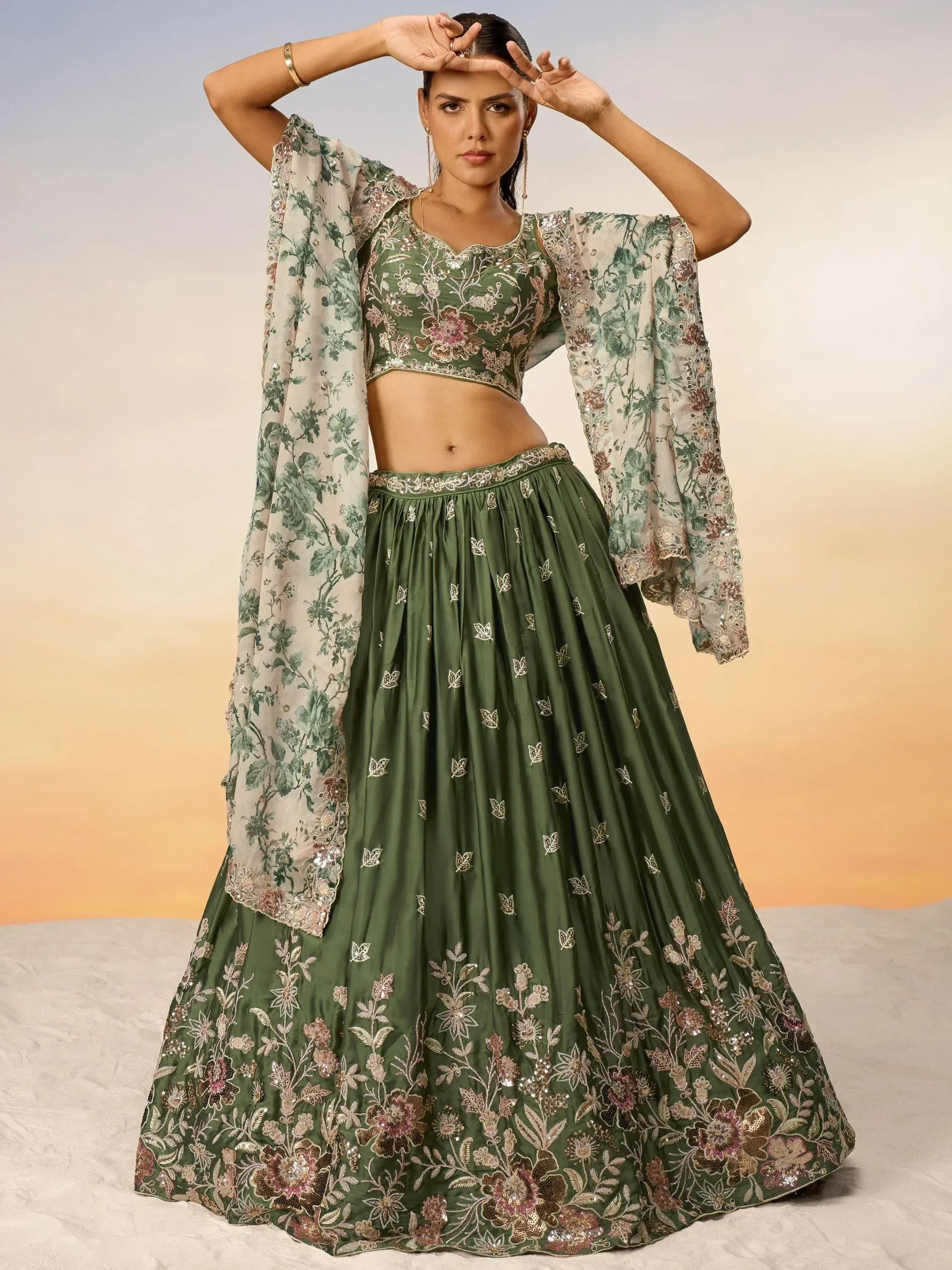 Elegant green embroidered lehenga choli with floral dupatta, perfect for Indian ethnic wear occasions.